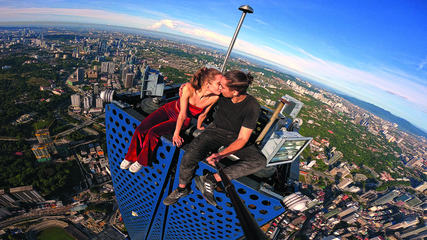 July 4 - Angela Nikolau and Ivan Beerkus, stars of “Skywalkers: A Love Story,” on top of a tall building. COURTESY NETFLIX