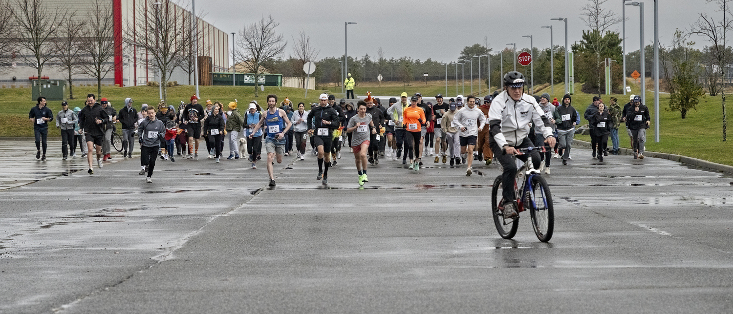 Trotters braved the rain on Thanksgiving day for the VFW Post 5350, Westhampton Beach Turkey Trot 5K Run/Walk at Gabreski Airport.  JOHN NEELY