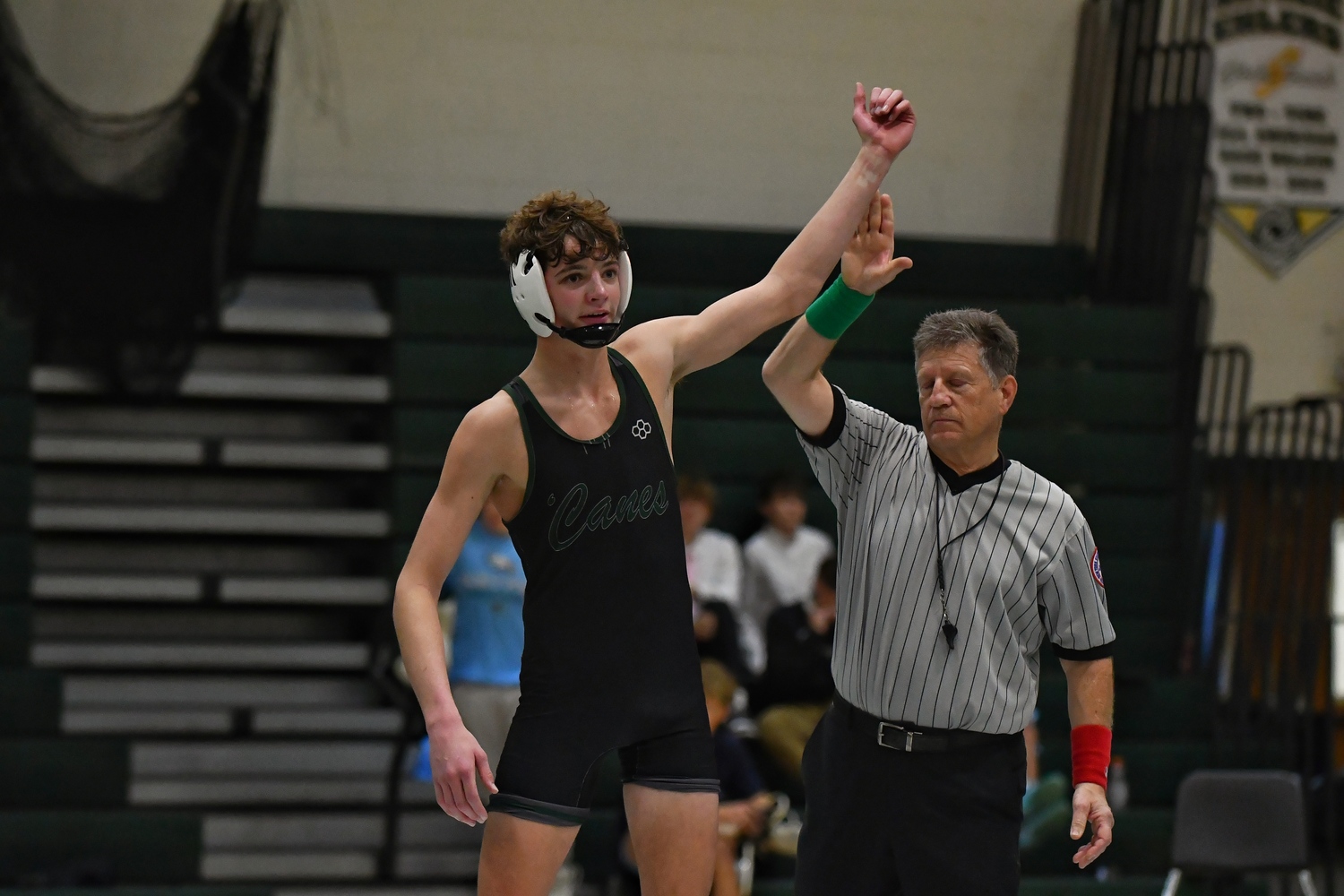 Westhampton Beach senior Max Orr gets his arm raised after pulling out a very close victory.   JEFF CANGELOSI