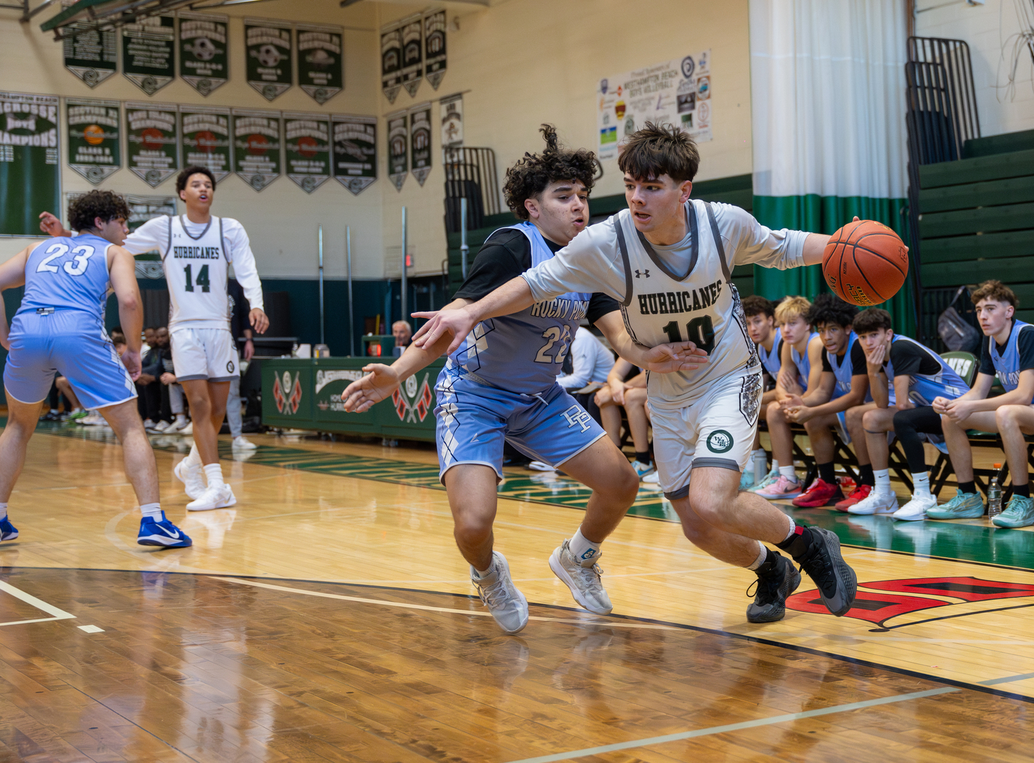 Junior point guard Truman Hahn drives to the basket. RON ESPOSITO