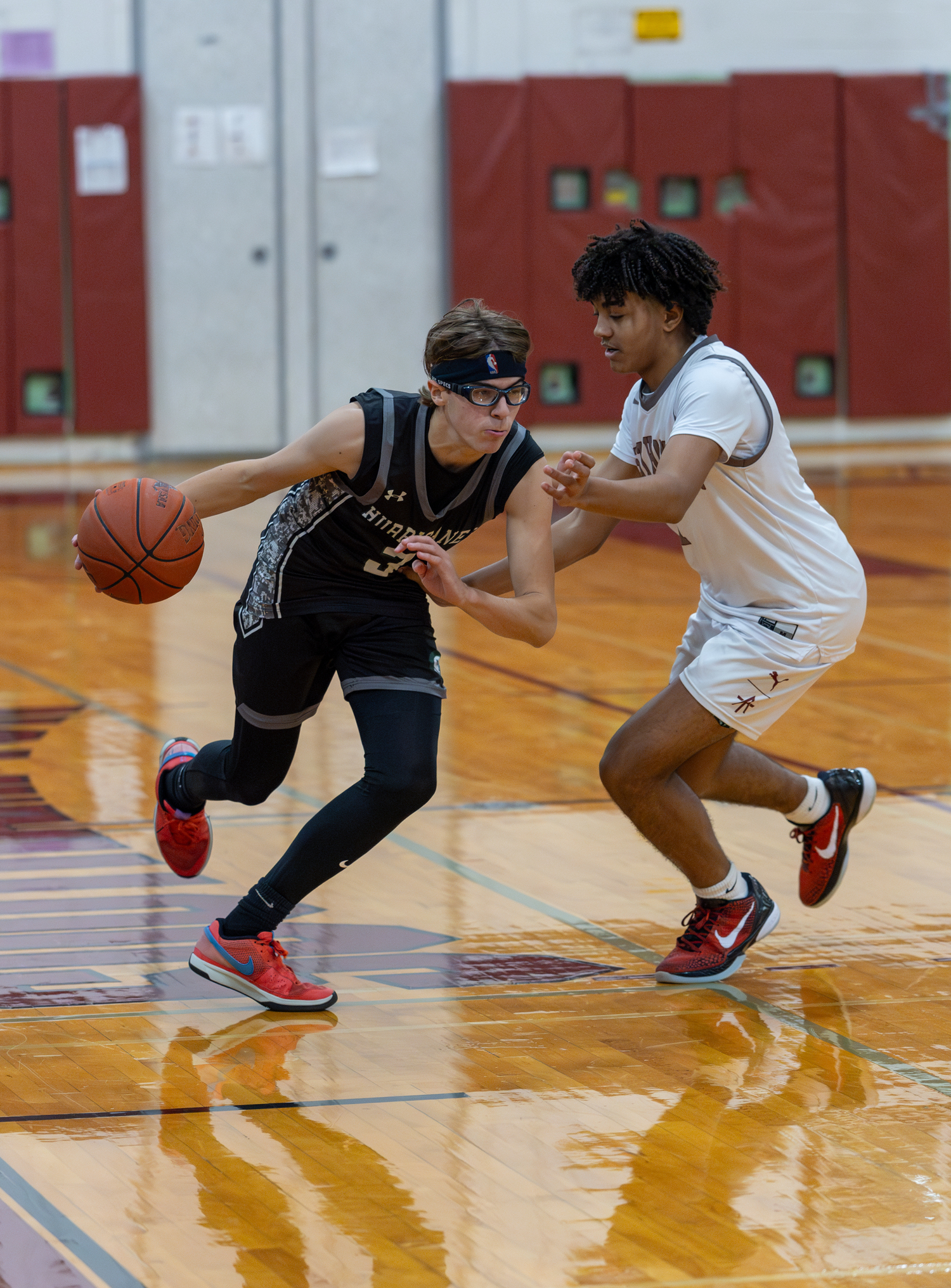 Westhampton Beach sophomore Sam Quinn drives on East Hampton junior Mason Jefferson.   RON ESPOSITO