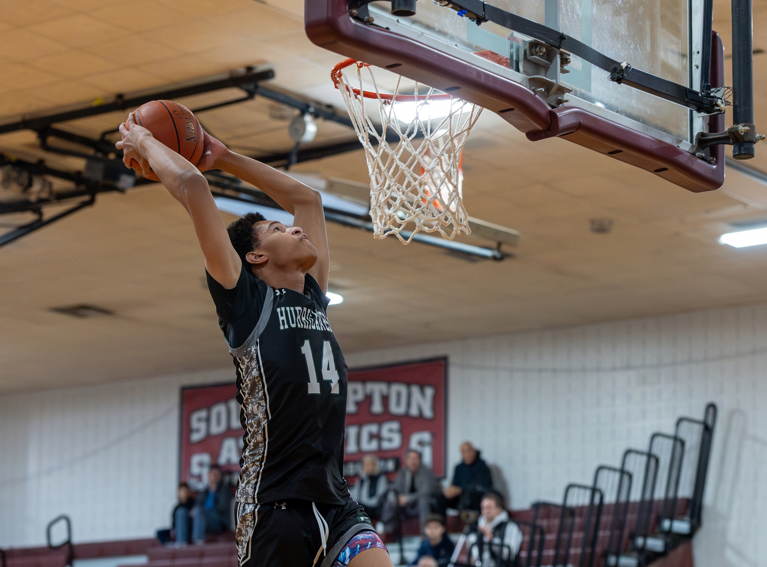 Westhampton Beach senior Jorden Bennett goes up with a two-hand jam.   RON ESPOSITO