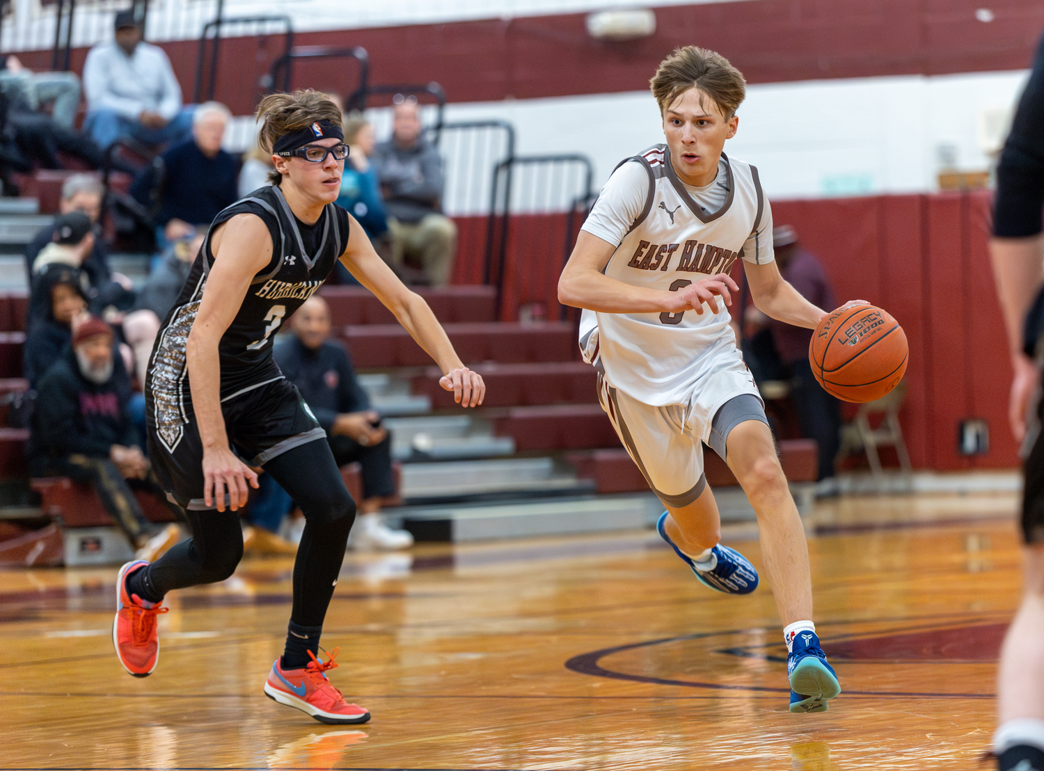 East Hampton junior Toby Foster with the ball at midcourt.   RON ESPOSITO