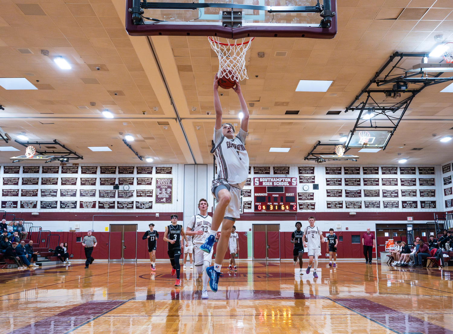 East Hampton junior Toby Foster goes in all alone.   RON ESPOSITO