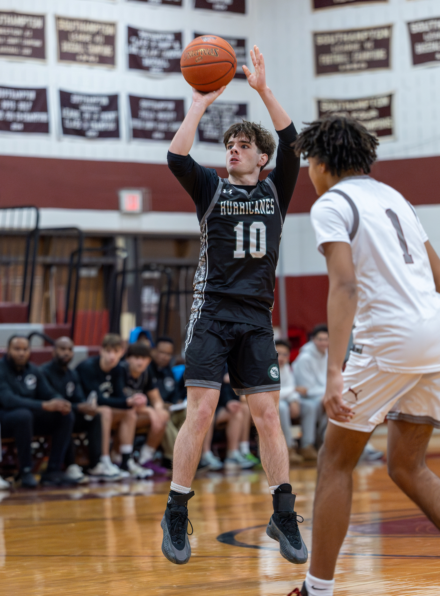 Westhampton Beach junior Truman Hahn spots up a three-pointer.   RON ESPOSITO