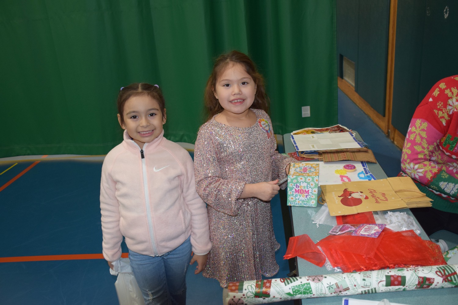 Westhampton Beach Elementary School students, including Adriana Suchite Giron 
and Tatiana Garcia Lopez,  kicked off the holiday season by shopping for loved ones at the PTA’s annual holiday fair. They spent time picking out the perfect gift from a large variety of items. COURTESY WESTHAMPTON BEACH SCHOOL DISTRICT