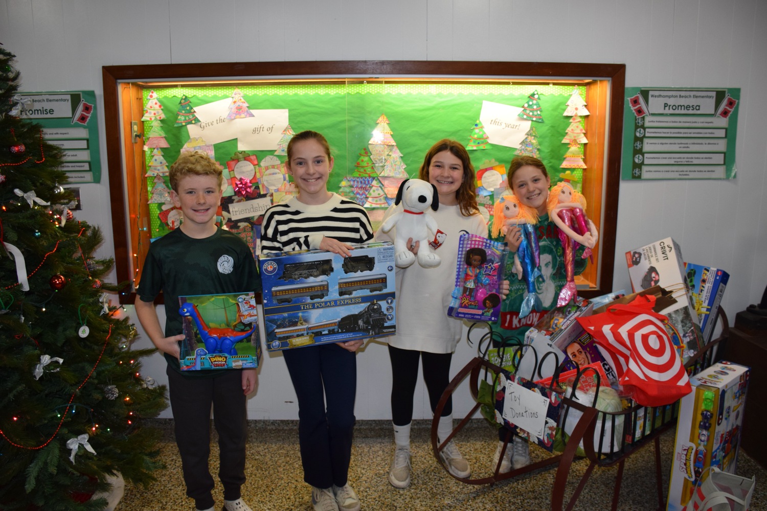 As part of their annual toy drive, members of the Westhampton Beach Elementary School Student Council have been collecting donations throughout the month of December. All of the items collected will be donated to those in need. From left, Hayes Ferran, Emilia Sohn, Andie Mett and Julietta Mastropierro. COURTESY WESTHAMPTON SCHOOL DISTRICT