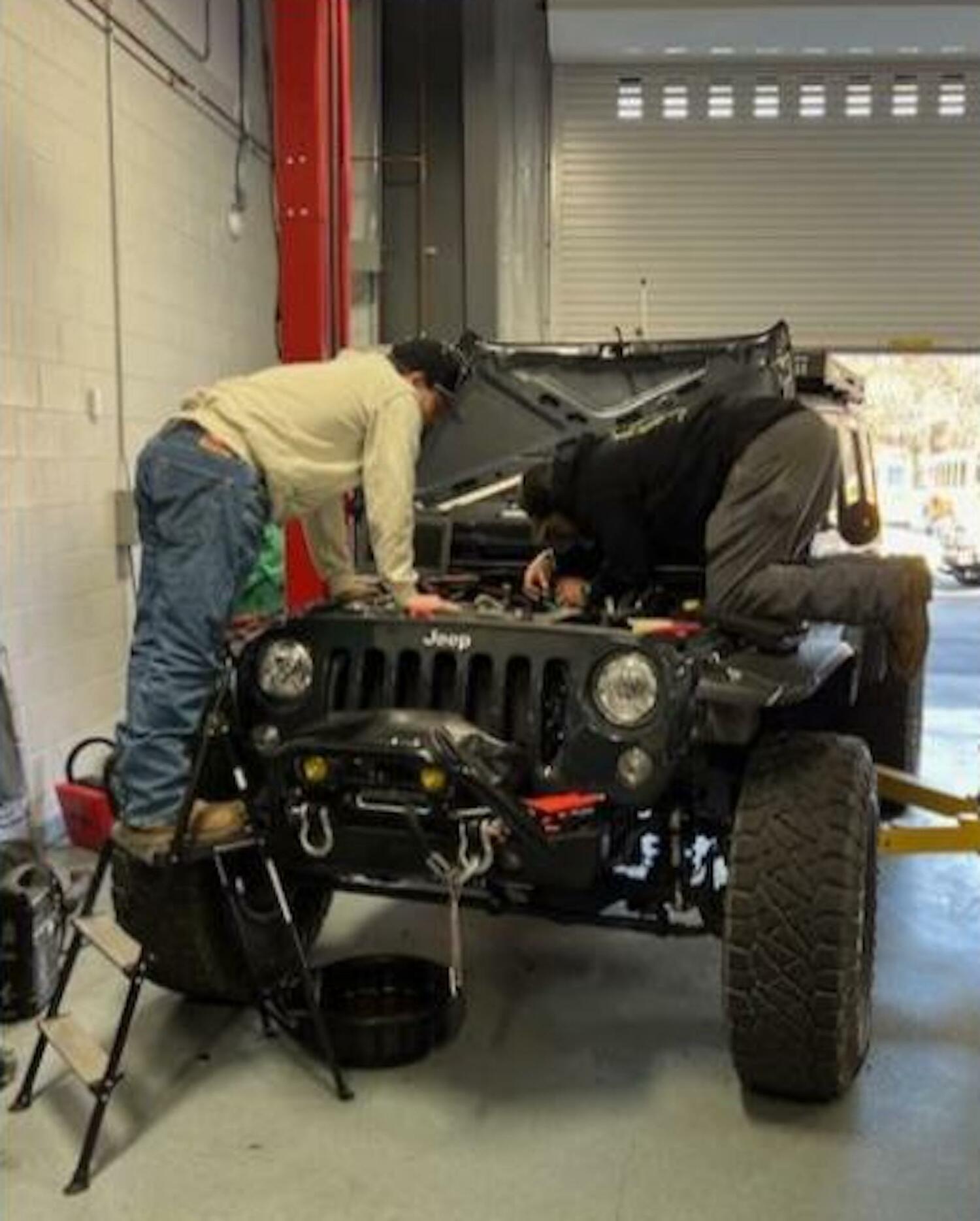 Students inn the automotive program work on a Jeep. EAST HAMPTON SCHOOL DISTRICT