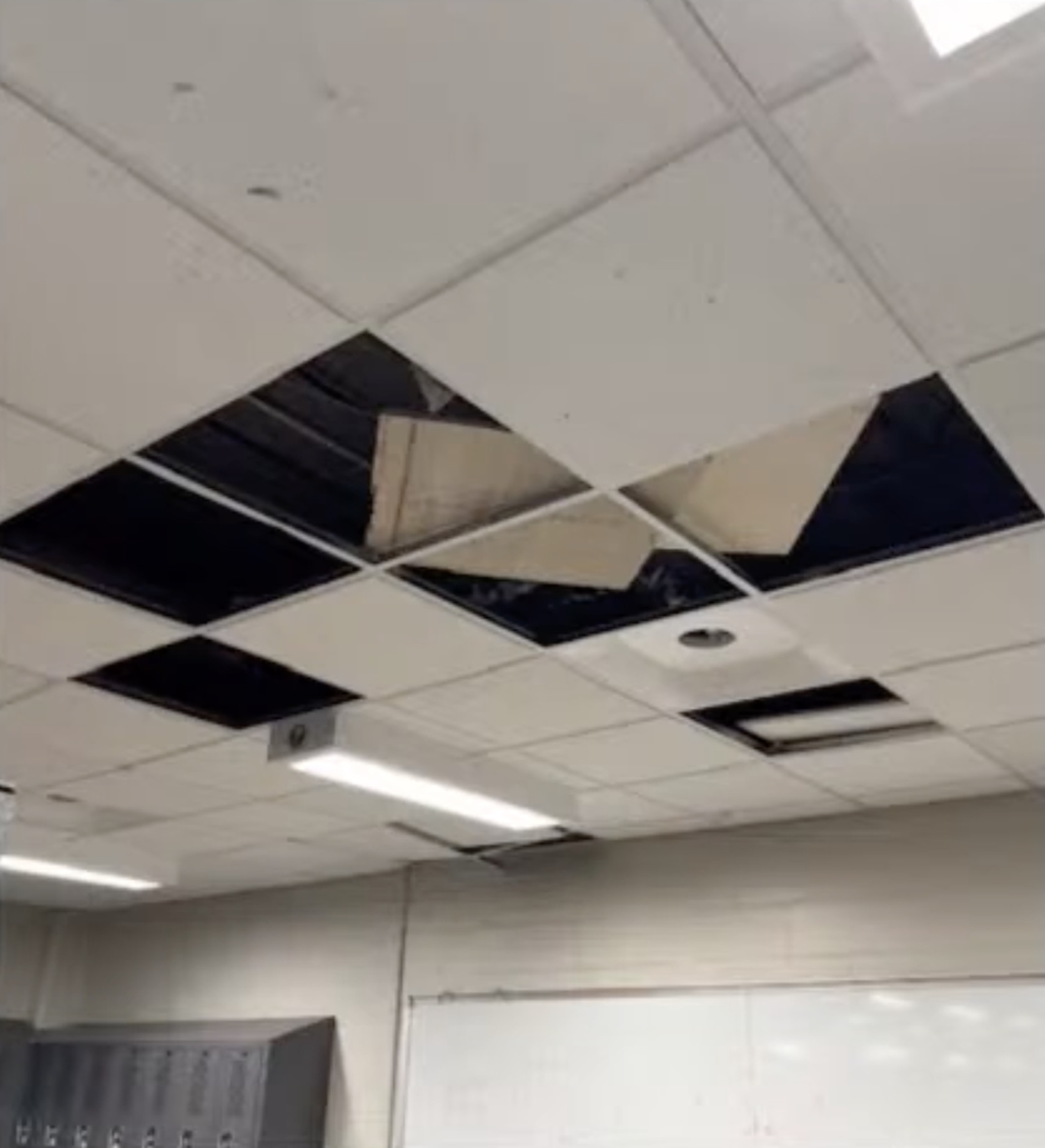 Drop ceiling tiles in East Hampton High School's locker room are broken and missing. EAST HAMPTON SCHOOL DISTRICT