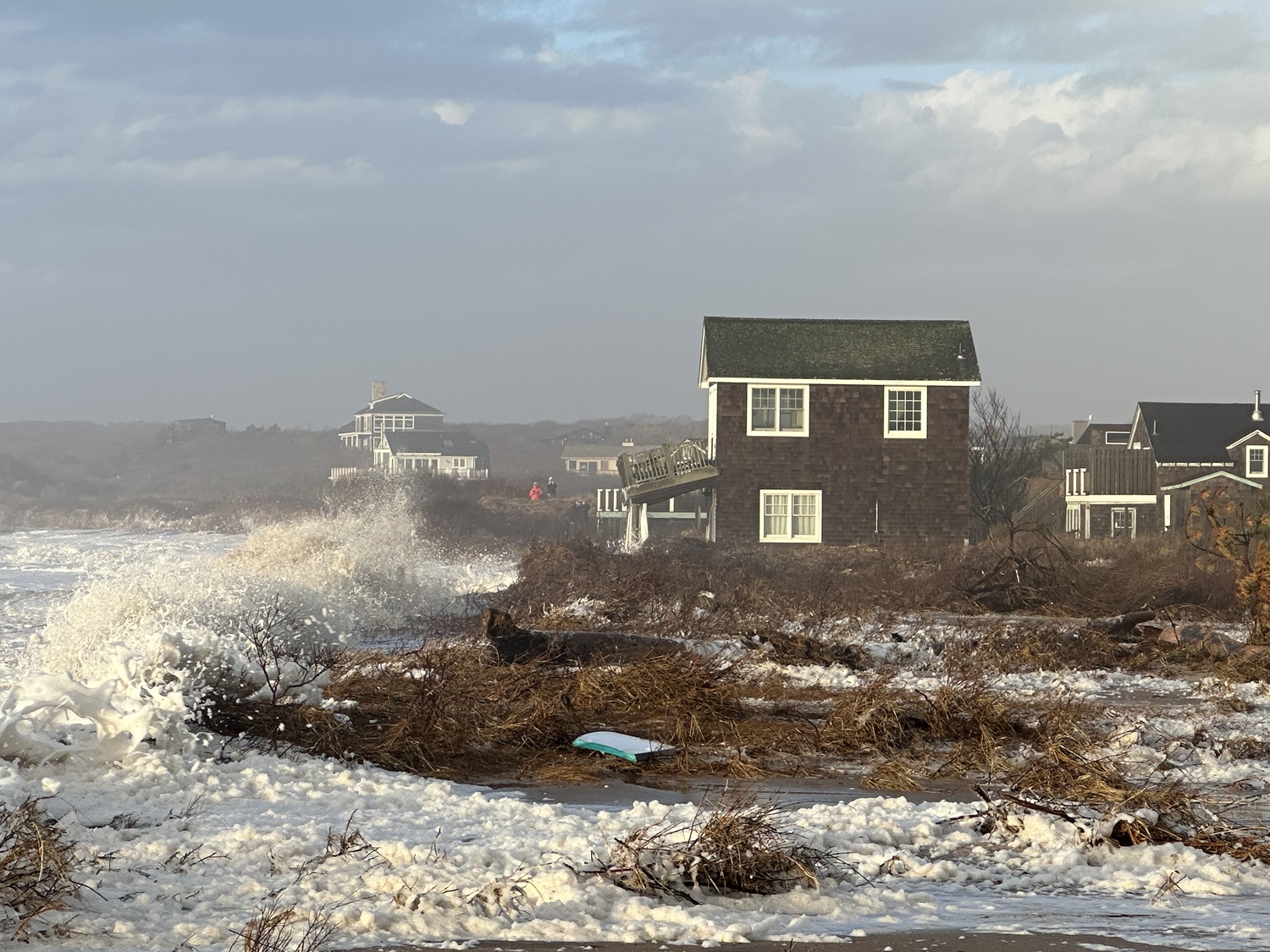 January 18 - A trio of storms that all brought tropical storm force winds to the South Fork in December 2023 have washed away the last remnants of dunes that separated some homes from the ocean at Ditch Plains. Town officials are appealing to federal and state agencies to help bolster the area against further loss of land in severe storms. DOUG KUNTZ