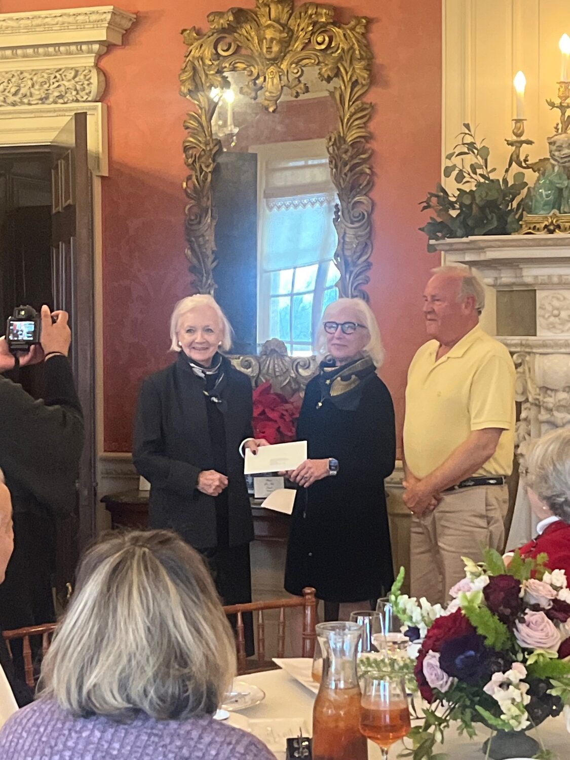 The Sag Harbor Historical Museum recently received a $10,000 grant from the Robert David Lion Gardiner Foundation toward the restoration of the Bee Bee headstones at the Old Burying Ground.  There will be six stones repaired by the museum in late May.  The largest of the headstones was broken by the Old Whalers' Church falling steeple in 1938.  From left, Nancy F. Achenbach, executive director Sag Harbor Historical Museum; Kathryn Curran, executivedDirector of the Robert David Lion Gardiner Foundation; and Zach Studenroth, president of the Sag harbor Historical Museum. COURTESY OLD WHALERS CHURCH