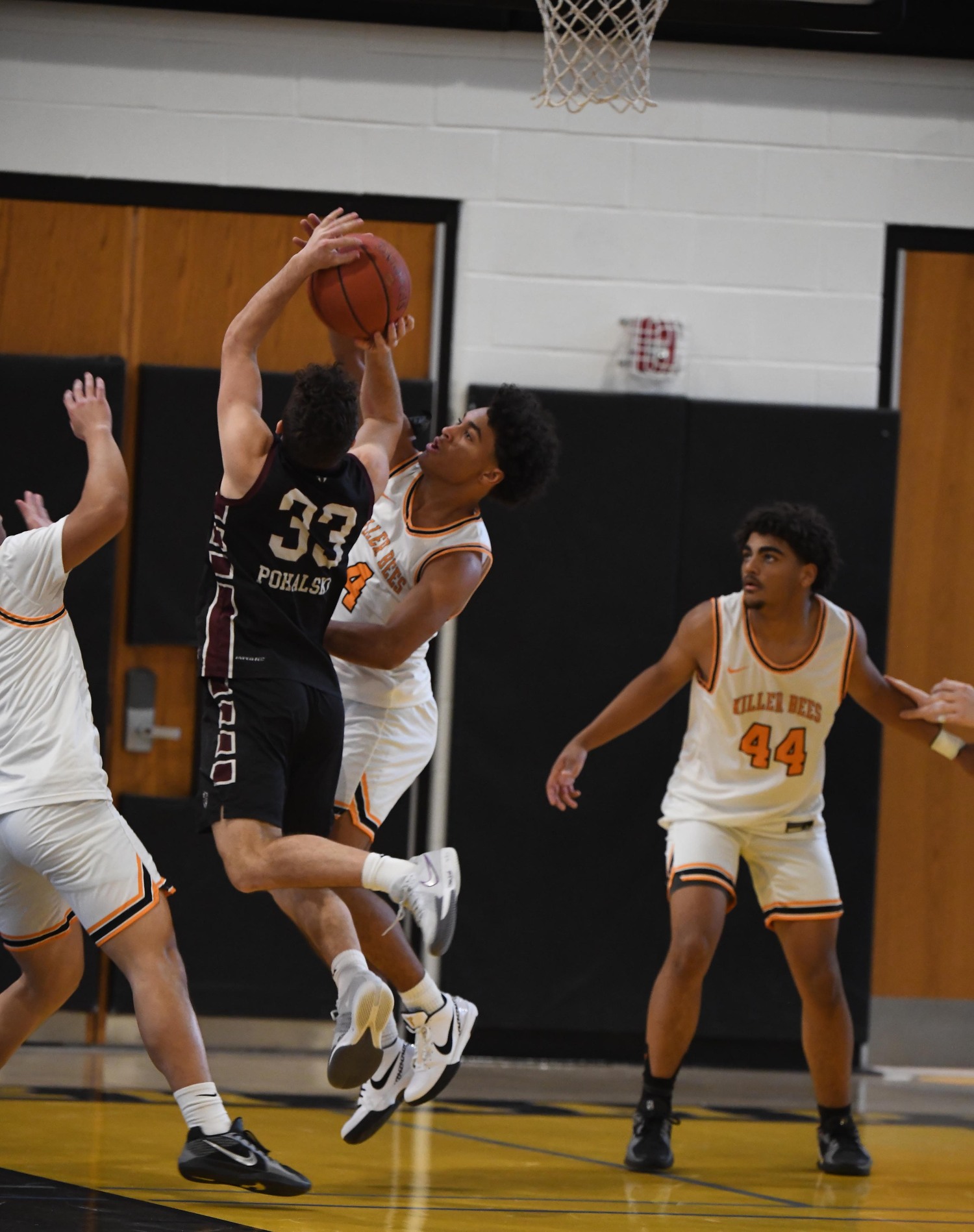 Bridgehampton junior Alex Davis gets a hand on the ball while a St. Pius player shooting.   DOUG KUNTZ