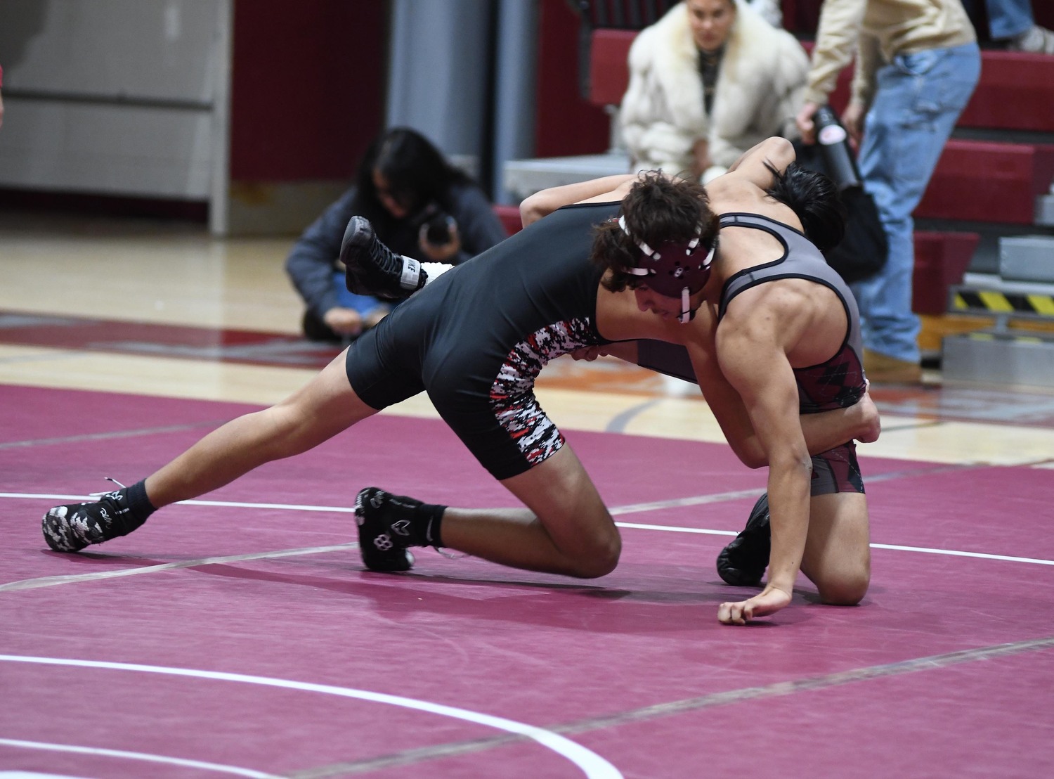 Andy Berrezueta tries to fend off his Newfield opponent.  DOUG KUNTZ