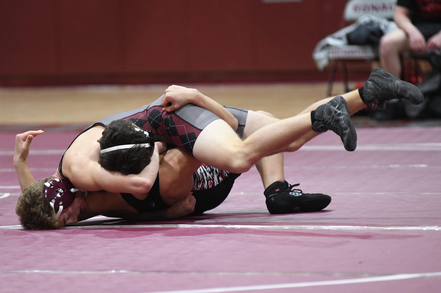 Michael Newmark tries to go for the pin. DOUG KUNTZ