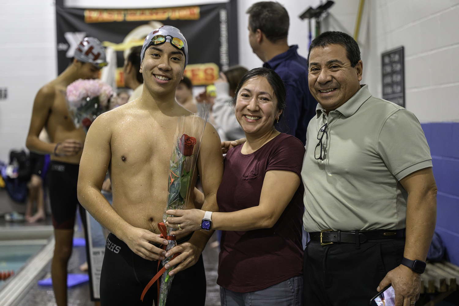 East Hampton senior Cristian Sigua, with his parents, was recognized on senior night. MARIANNE BARNETT