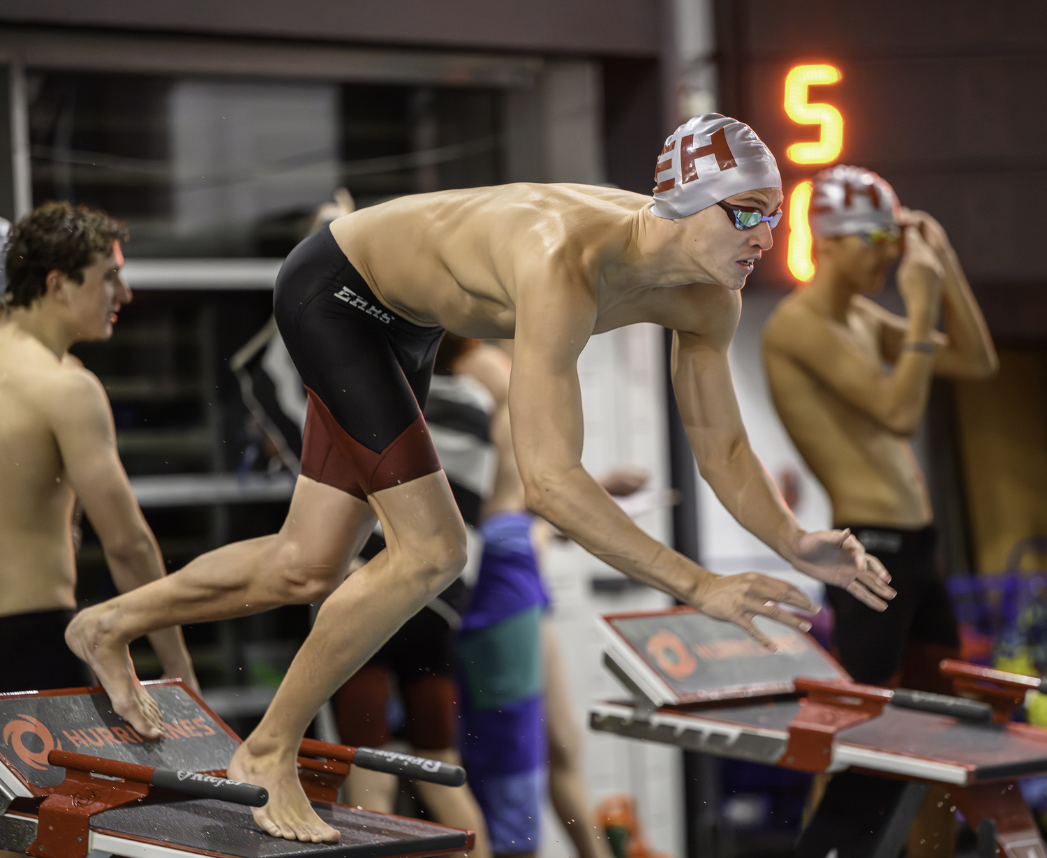 East Hampton junior Liam Knight dives into the pool. MARIANNE BARNETT