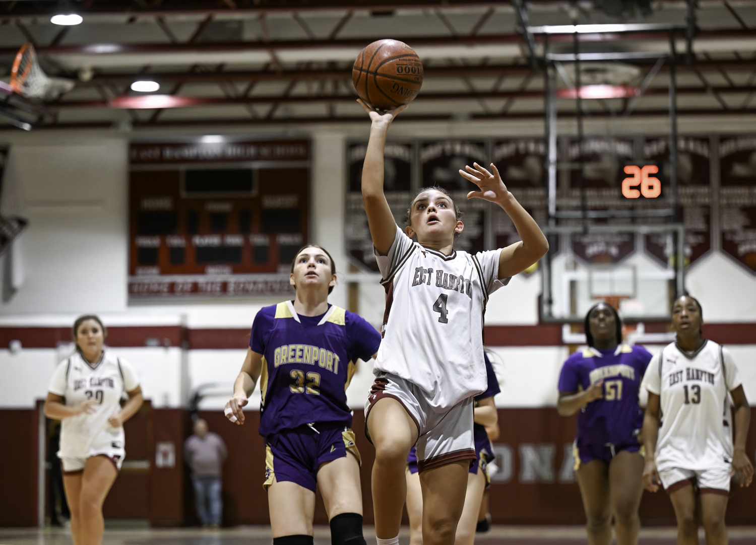 East Hampton junior Brynley Lys finishes off a fast break with a layup.   MARIANNE BARNETT