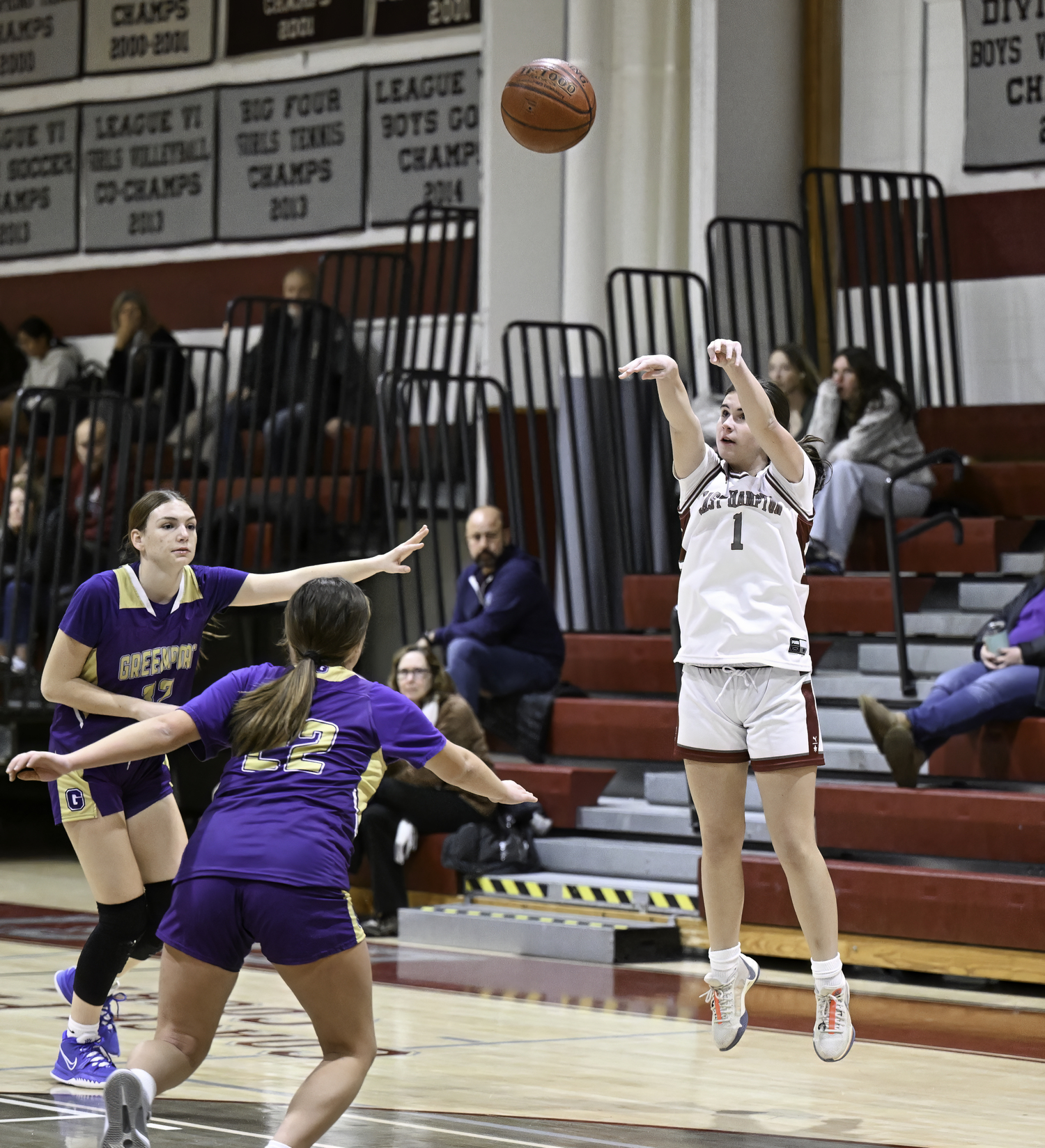 East Hampton's Colleen McKee shoots a three-pointer.  MARIANNE BARNETT