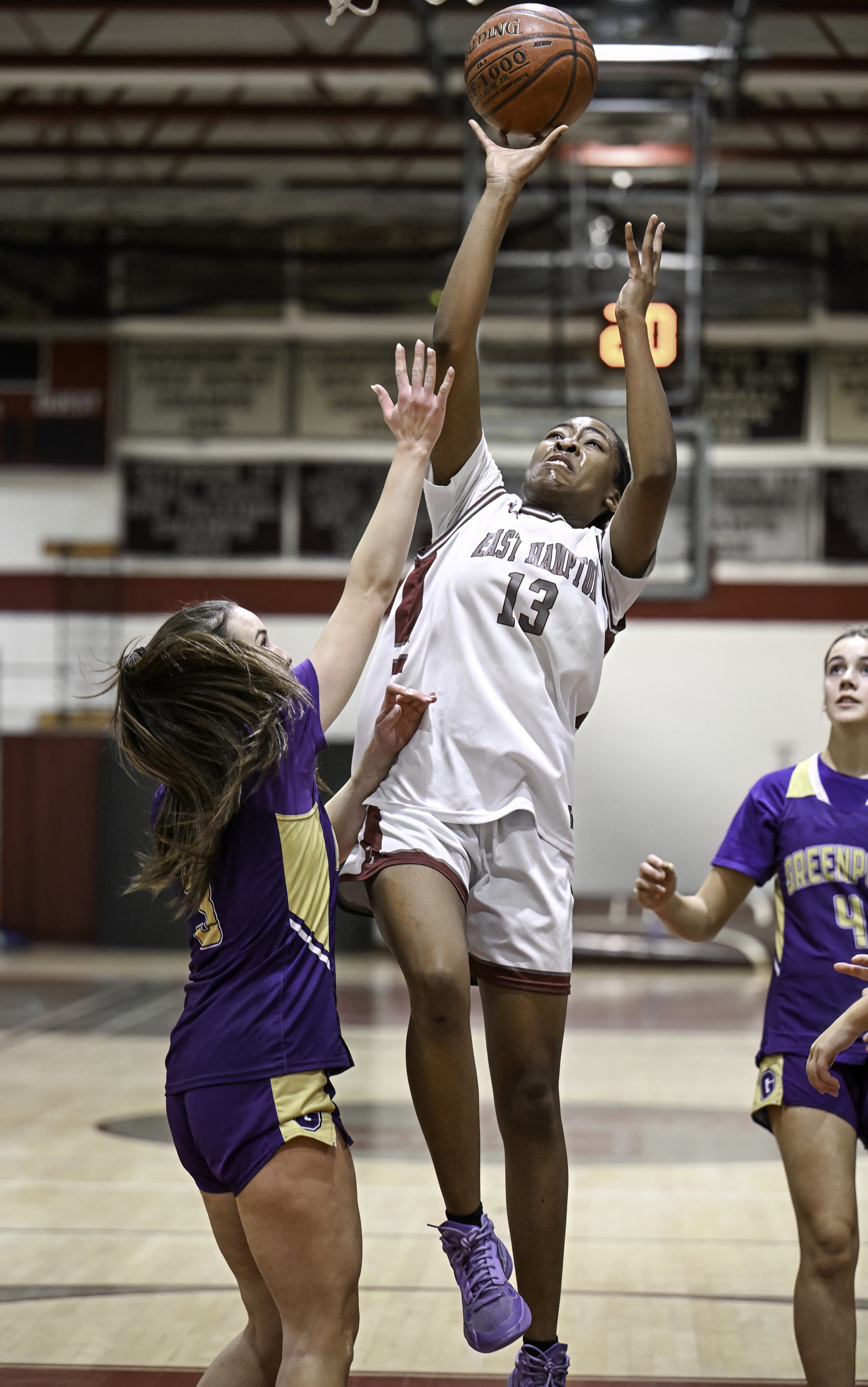 K.K. Moore shoots over a Greenport/Southold player. MARIANNE BARNETT