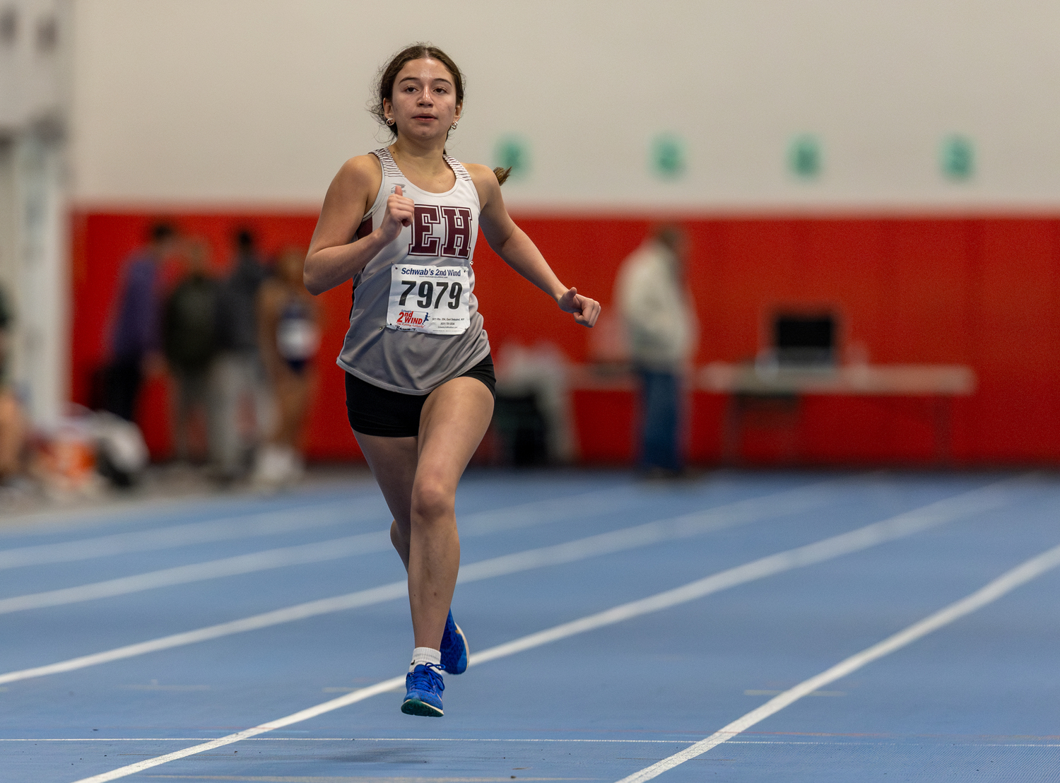 Briana Torres runs down the straightaway at Suffolk County Community College in Brentwood.  RON ESPOSITO