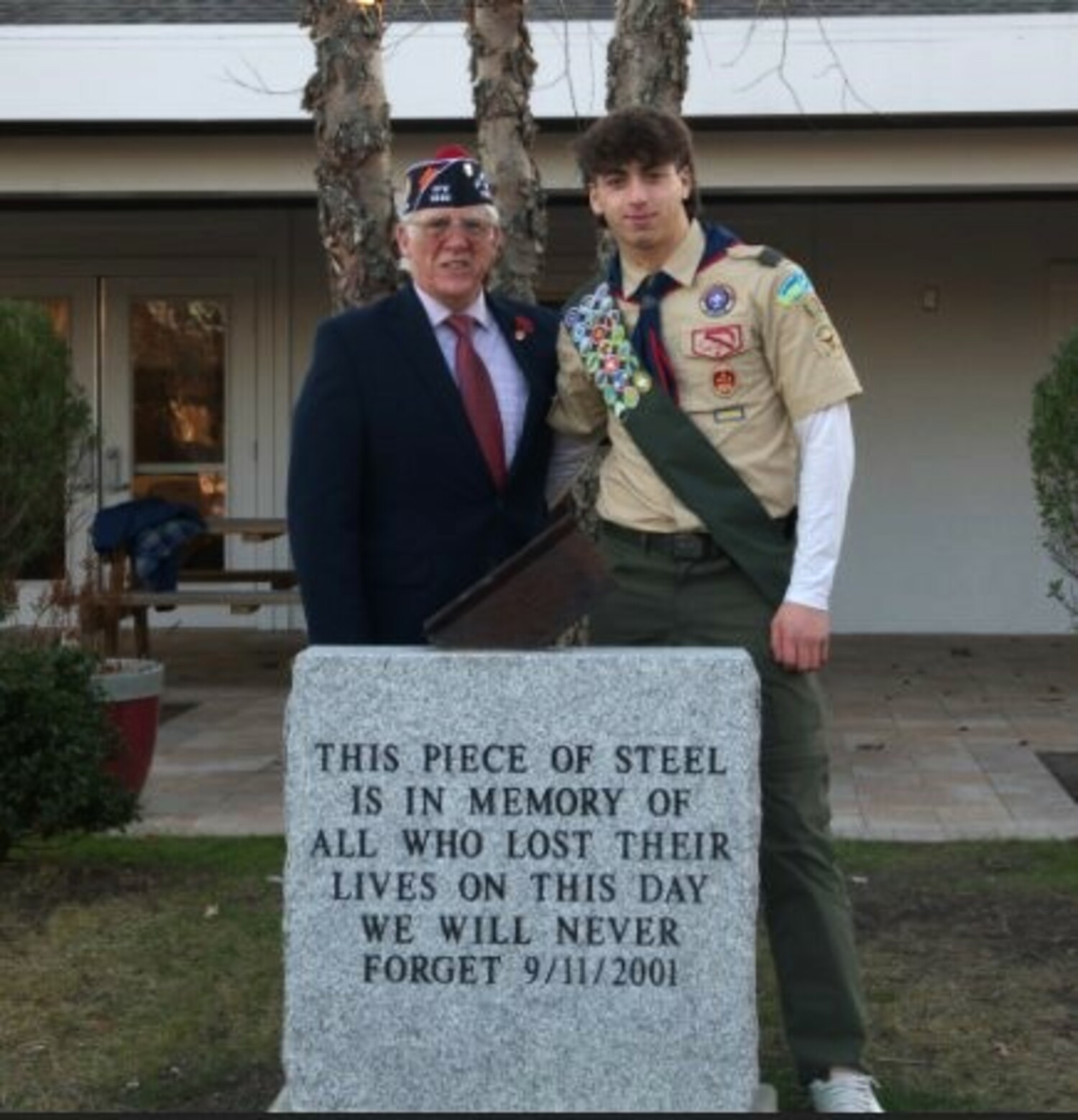 An Eagle Scout Court of Honor was held at VFW POST 5350 last month, during which George Ostensen and his brother James Ostensen were both elevated to the rank of Eagle Scout. George's Eagle Scout project was an 850 lb. engraved granite monument with a section of steel from the World Trade Center 911 attack on America. The monument is prominently installed at the VFW Post. Post Commander William Hughes with George Ostensen. COURTESY WILLIAM HUGHES