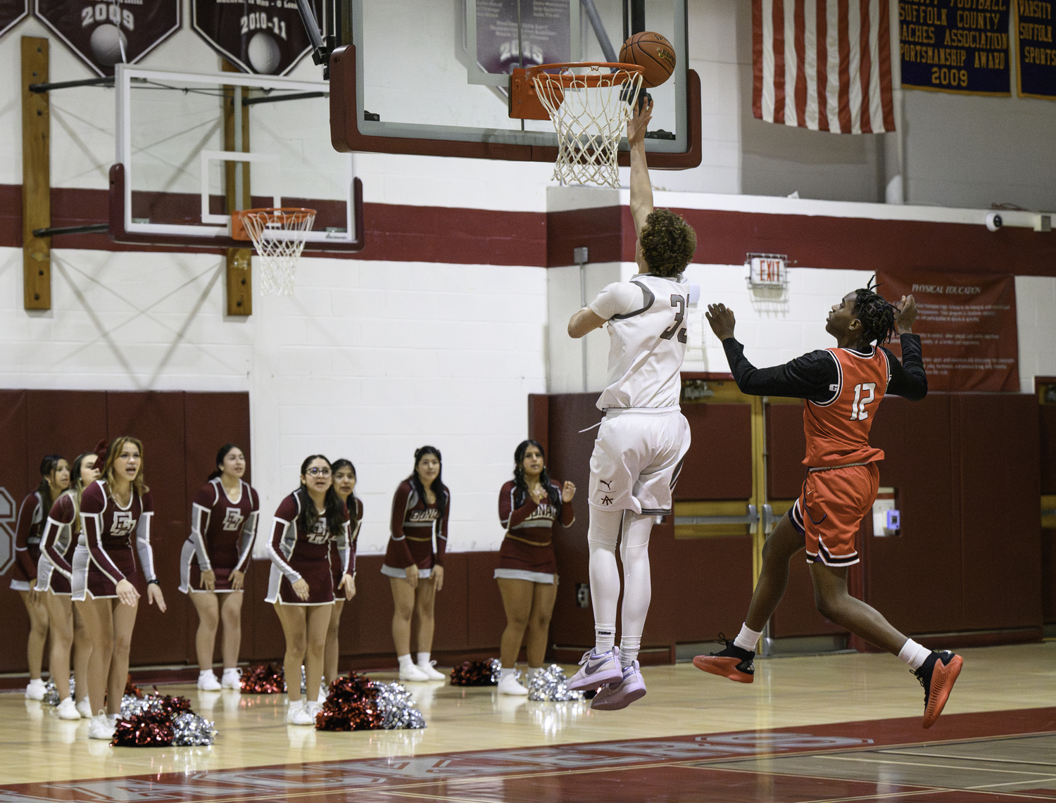 Sophomore Miles Menu scores the first basket of the game for East Hampton.   MARIANNE BARNETT