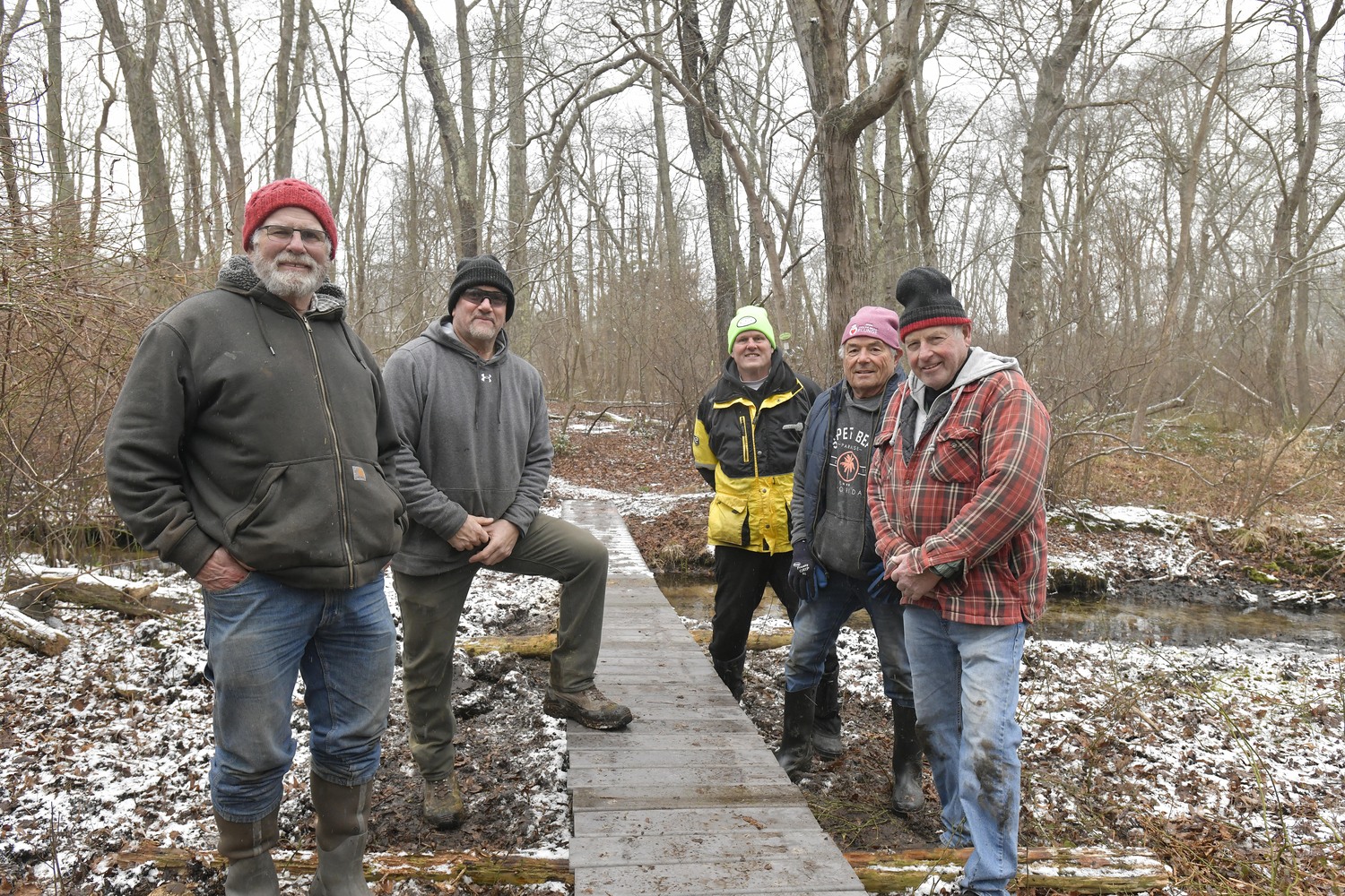 Tim Corwin, Kevin MacFarlane, Scott Lewis, John Bergenti and Roy McCarthy of  Old Town Masonic Lodge #908 rebuilt a bridge across the Paumanok Path in North Sea on Saturday as a public service over the past two weekends. All work and materials were donated.  DANA SHAW