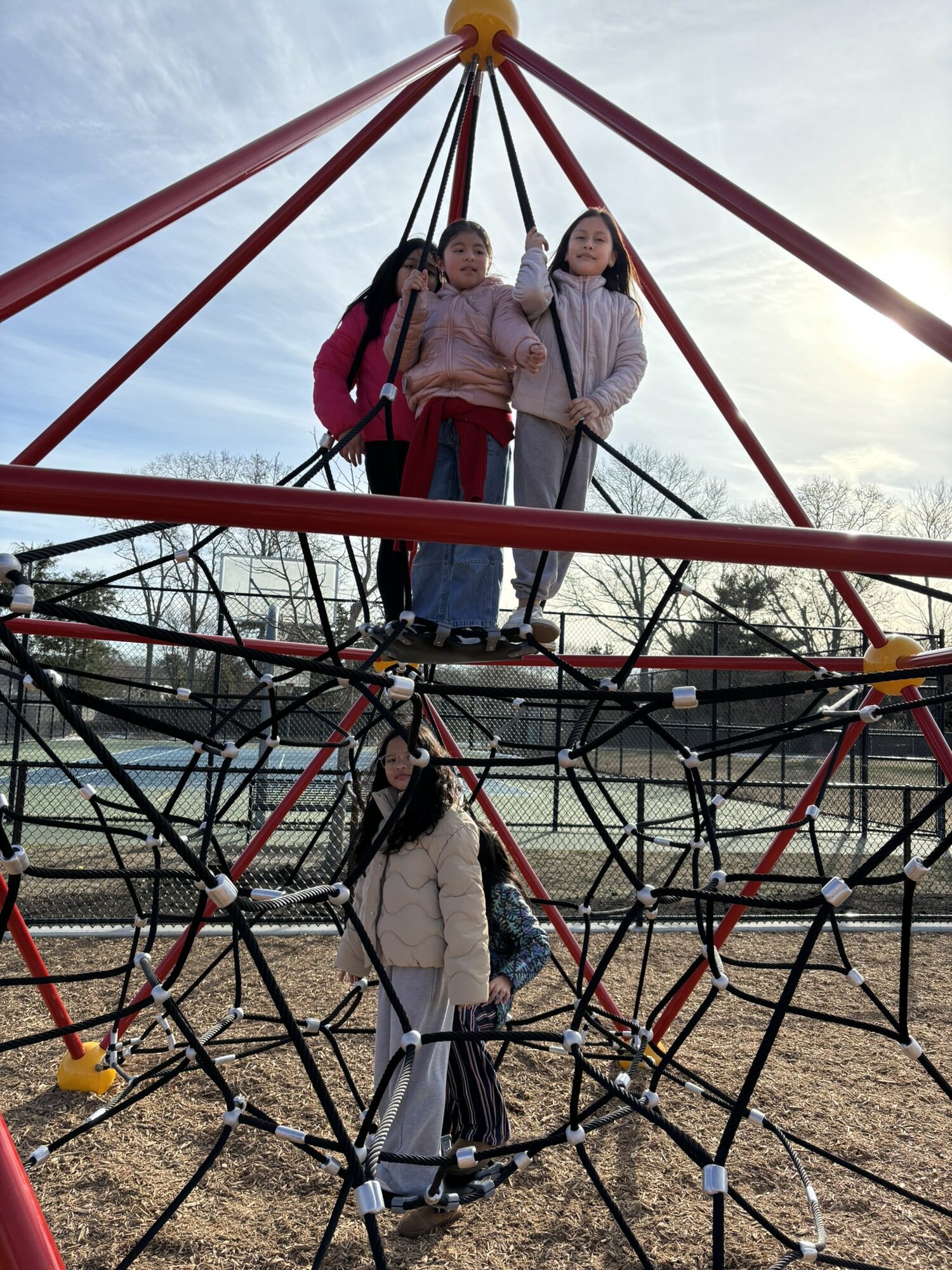 Hampton Bays Elementary School students were filled with excitement recently with the opening of an expanded playground, which has been in the works since 2022. New play structures, a fitness course with various obstacles and a RopeVenture Vertex have been added, as well as nearby benches. COURTESY HAMPTON BAYS SCHOOL DISTRICT