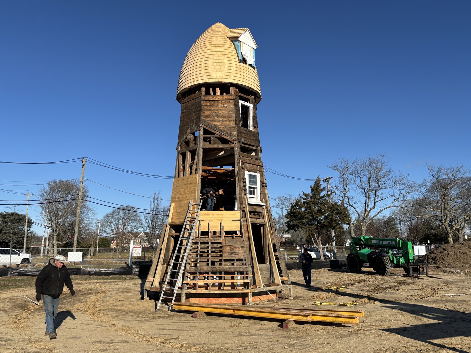 The top two portions of the Dix Windmill were placed on top of the windmill last Thursday, January 2, on the Great Lawn in Westhampton Beach. COURTESY MATT JEDLICKA, LKMA