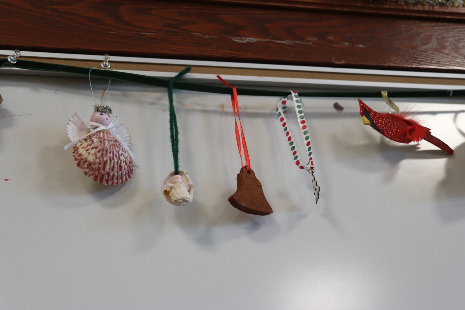 Samples of many of the homemade Christmas ornaments that Marjorie Ridgway has made over the years were on display at her 100th birthday celebration at the Windmill Lane Firehouse in Southampton on January 4. CAILIN RILEY