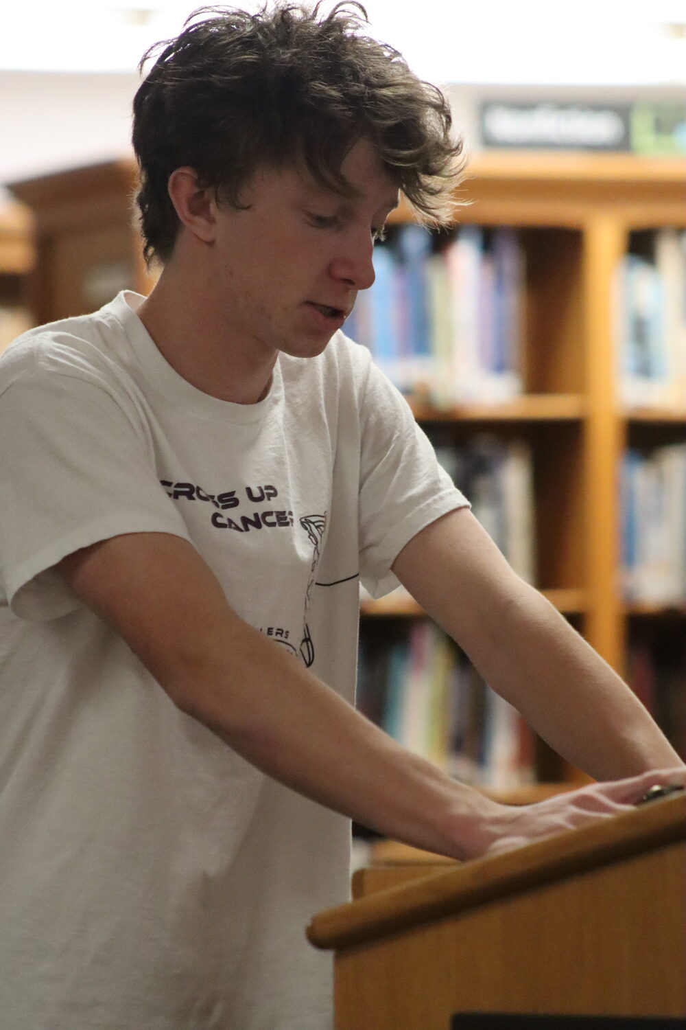 Sophomore Brian Schroeder, a member of the Pierson varsity boys basketball team, speaks during public comment at the board of education meeting. CAILIN RILEY