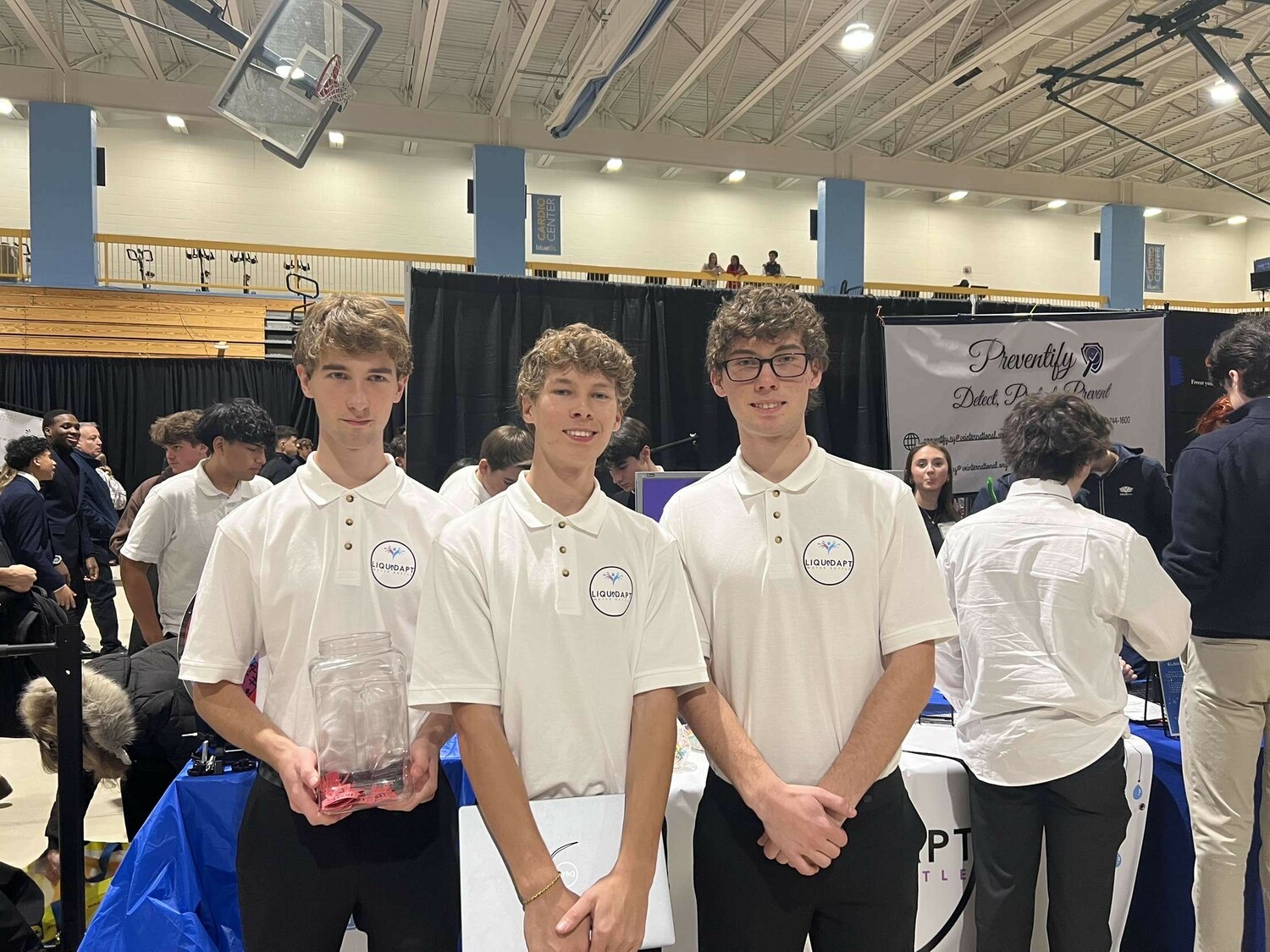 East Hampton High School students Cody Debackere, Owen Debackere and Adam Debackere at the Virtual Enterprise Trade Show in early January.