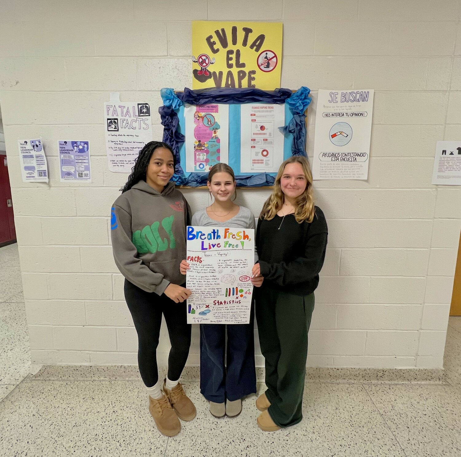 East Hampton High School students Melanie Vizcaino, Lauren Rosario and Jade Samuelson display posters they have worked on as a part of the “Vape Out,” a new initiative in the East Hampton School District aimed at spreading awareness and reducing the number of students vaping in the high school. BRADLEY RODRIGUEZ