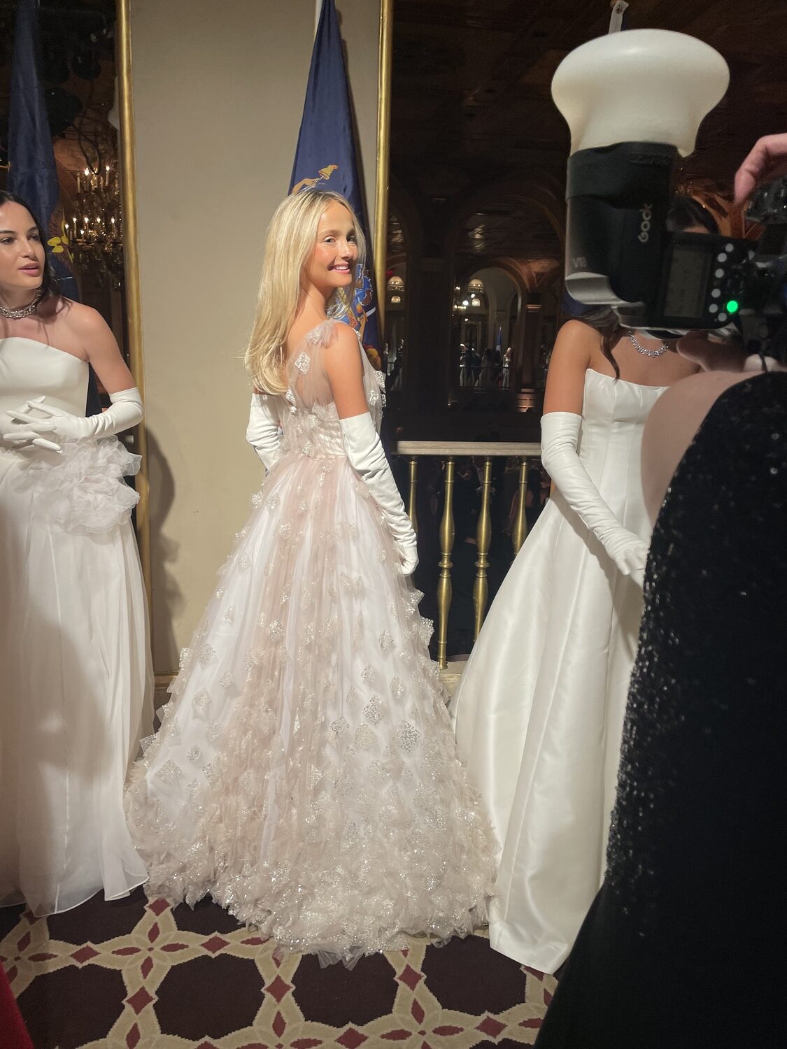 Kelli Chambers Ford, a part-time Southampton resident, posing for photos while standing on the receiving line at the 70th anniversary International Debutante Ball at the Plaza Hotel in New York City on December 28. CAILIN RILEY