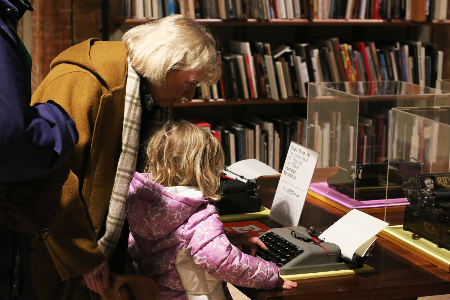 Visitors checking out the typewriters at The Church's opening reception for 