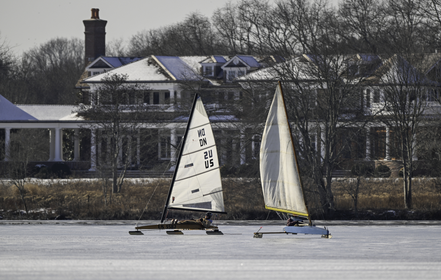 Ice boats race around Mill Pond on Friday.   MARIANNE BARNETT