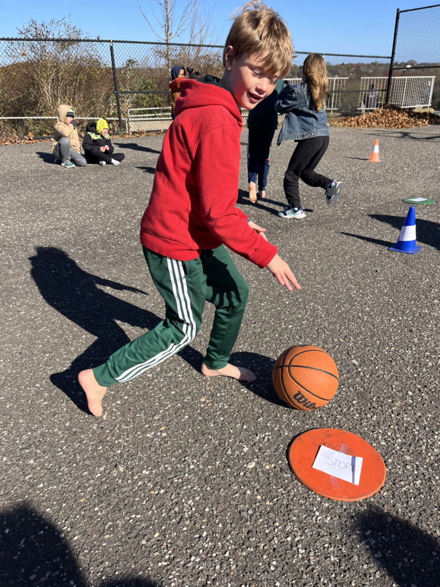 A Montauk School student plays basketball barefoot.  COURTESY MARK CRANDALL