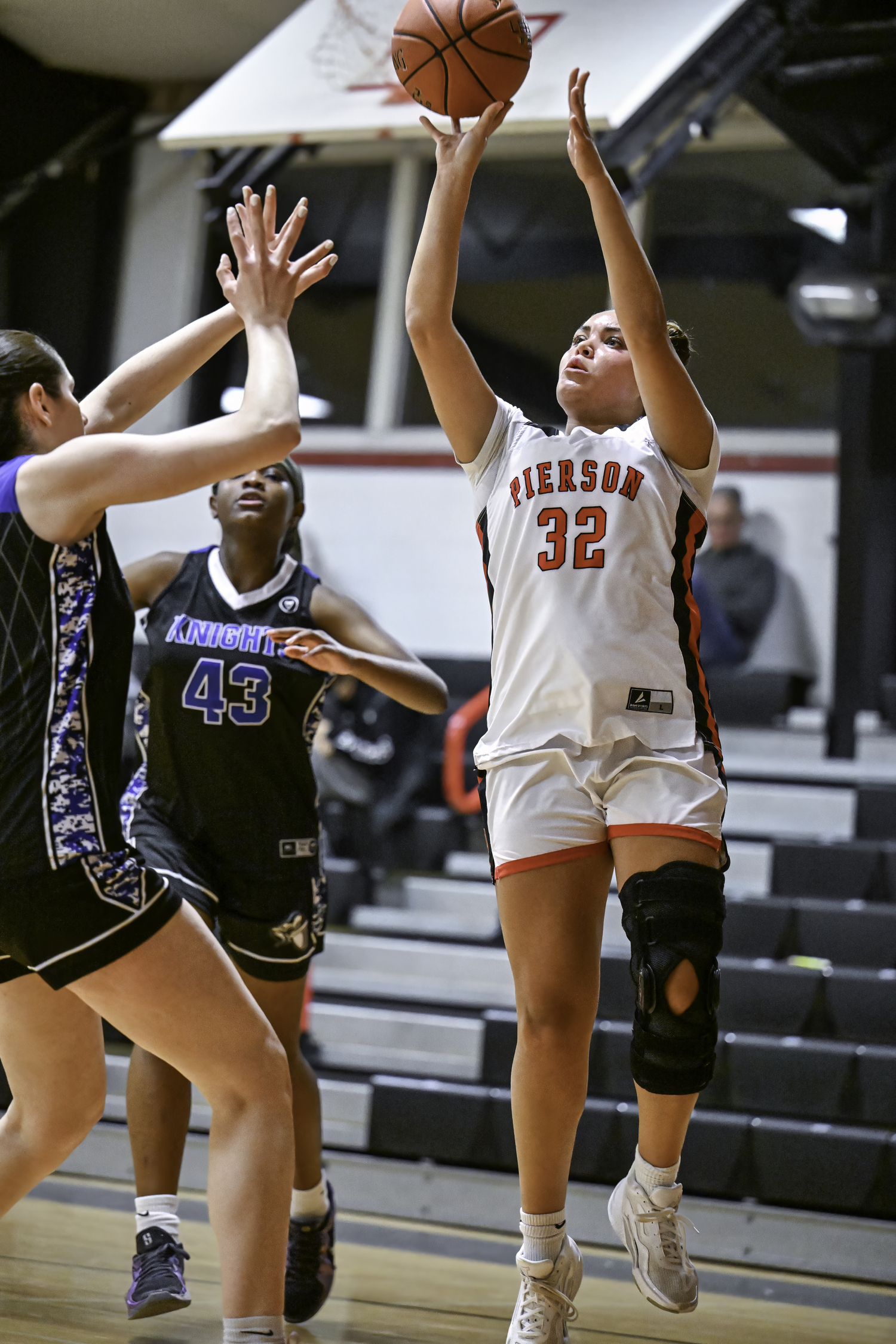 Pierson senior Ani Bedini shoots over Giuliana Cervini.   MARIANNE BARNETT