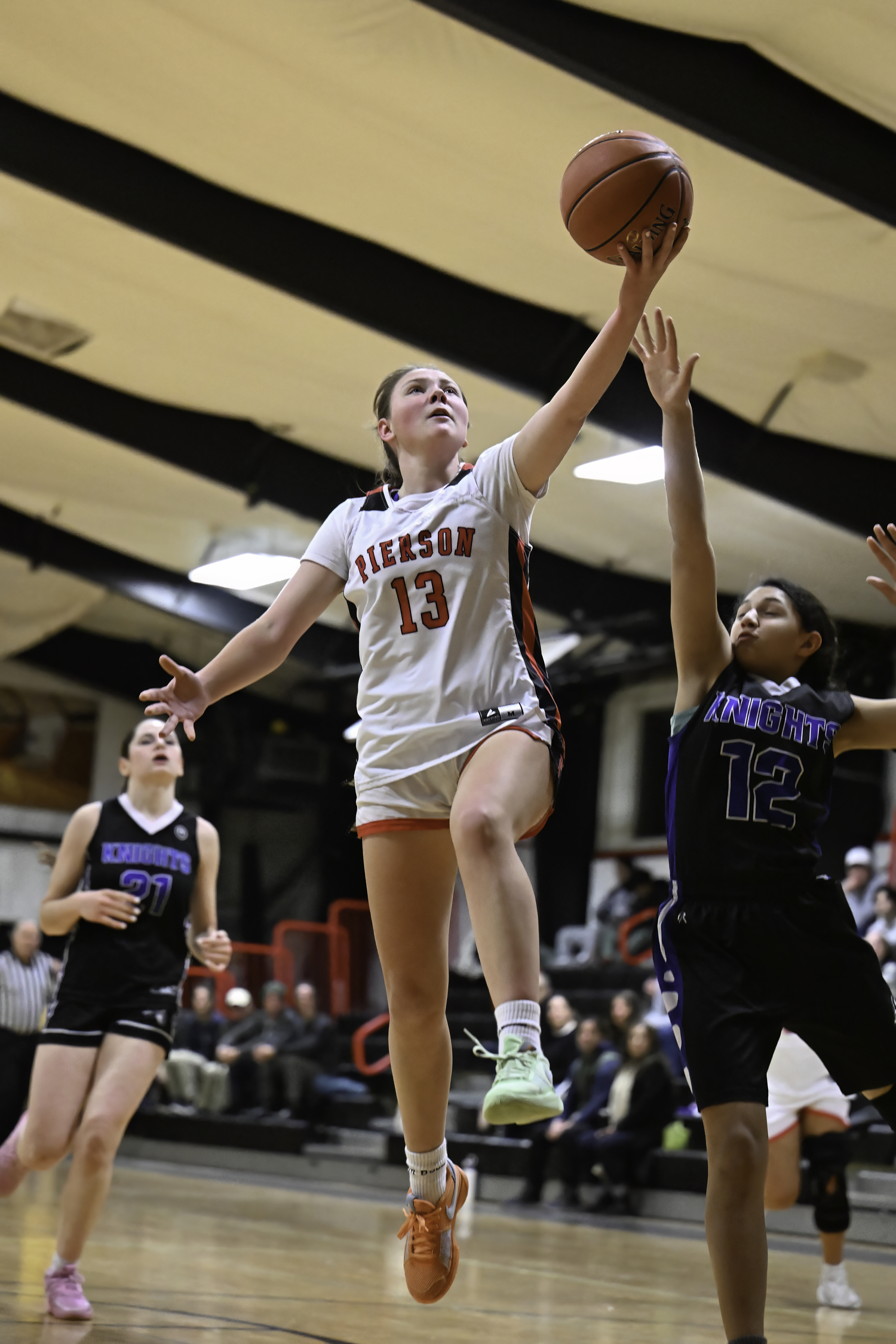 Senior Whaler Cali Wilson goes up with the ball.  MARIANNE BARNETT