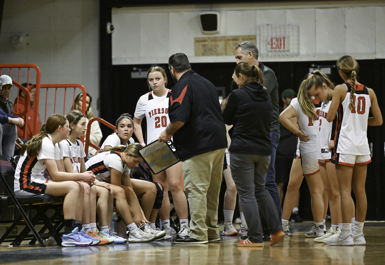 The Whalers regroup during a timeout.  MARIANNE BARNETT