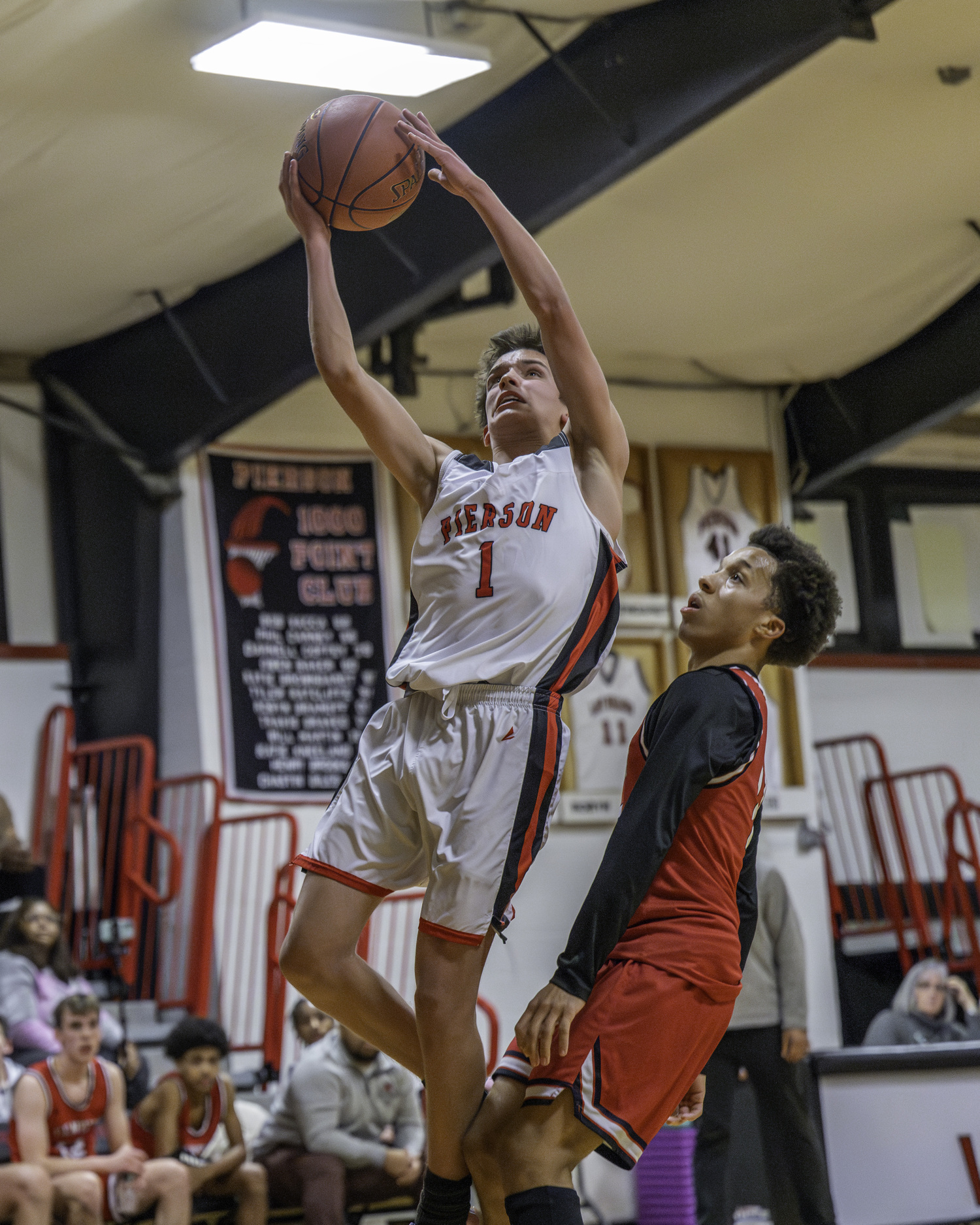 Pierson sophomore Joel Mather attacks the basket.   MARIANNE BARNETT