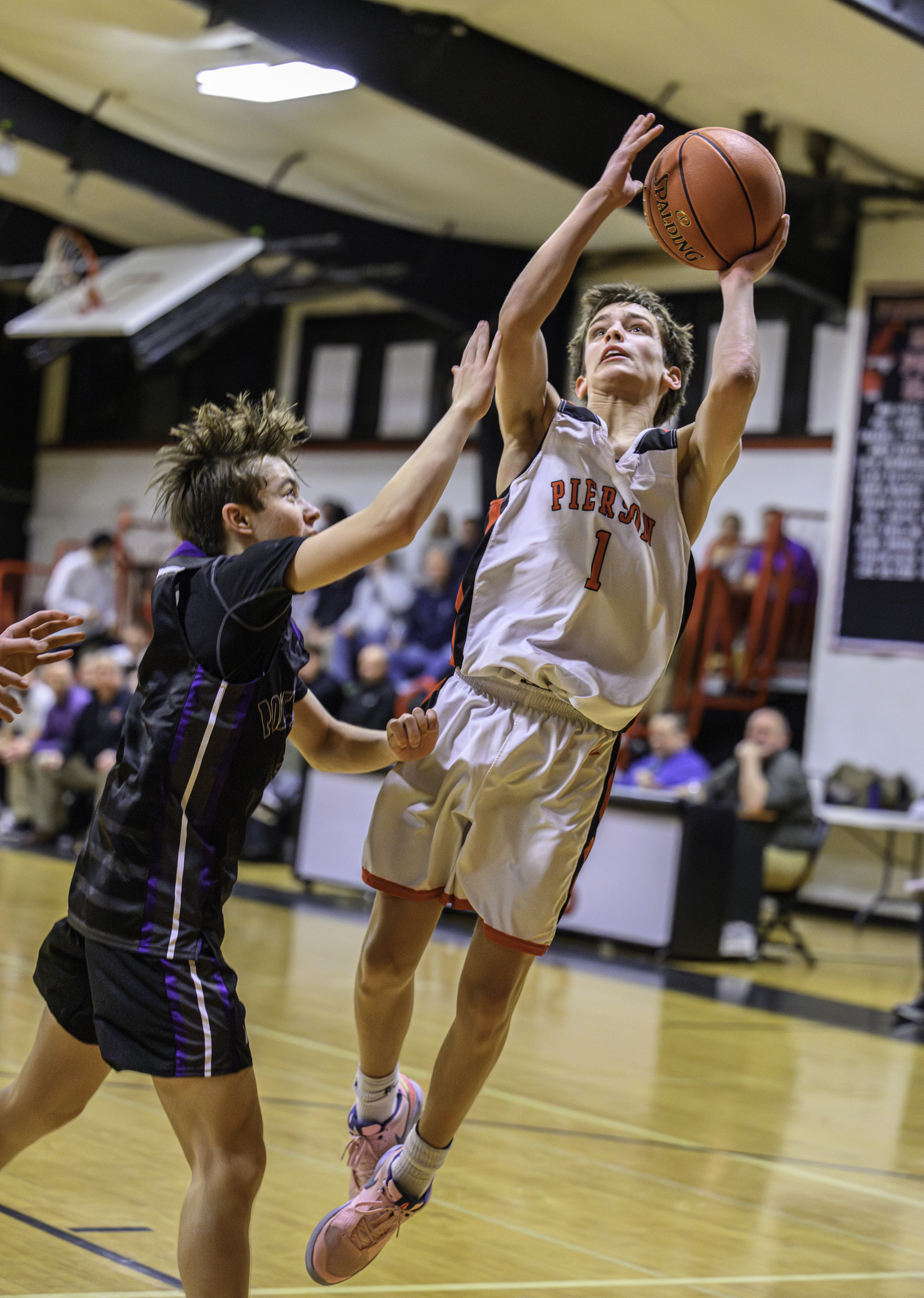 Joel Mather gets an awkward shot off depsite being pressured by a Port Jeff defender.  MARIANNE BARNETT