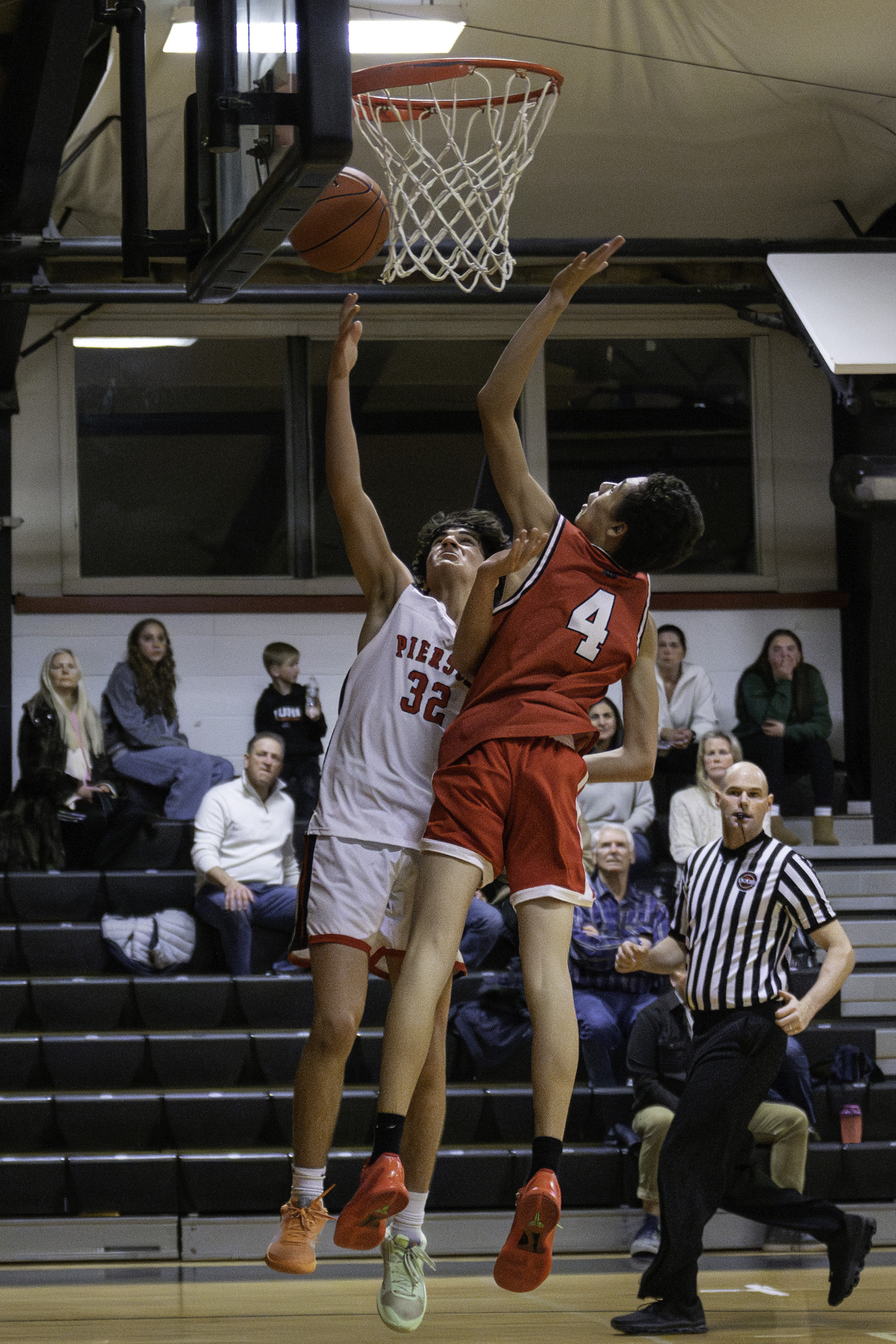 Pierson's Max Vogel scores despite pressure from Carter Levar of Center Moriches.   MARIANNE BARNETT