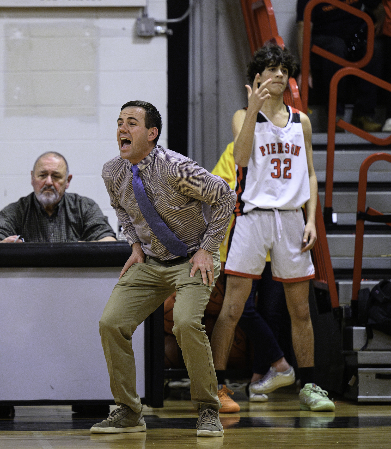 Pierson head coach Dan White and Max Vogel react to a key three-pointer late in Friday night's game.  MARIANNE BARNETT