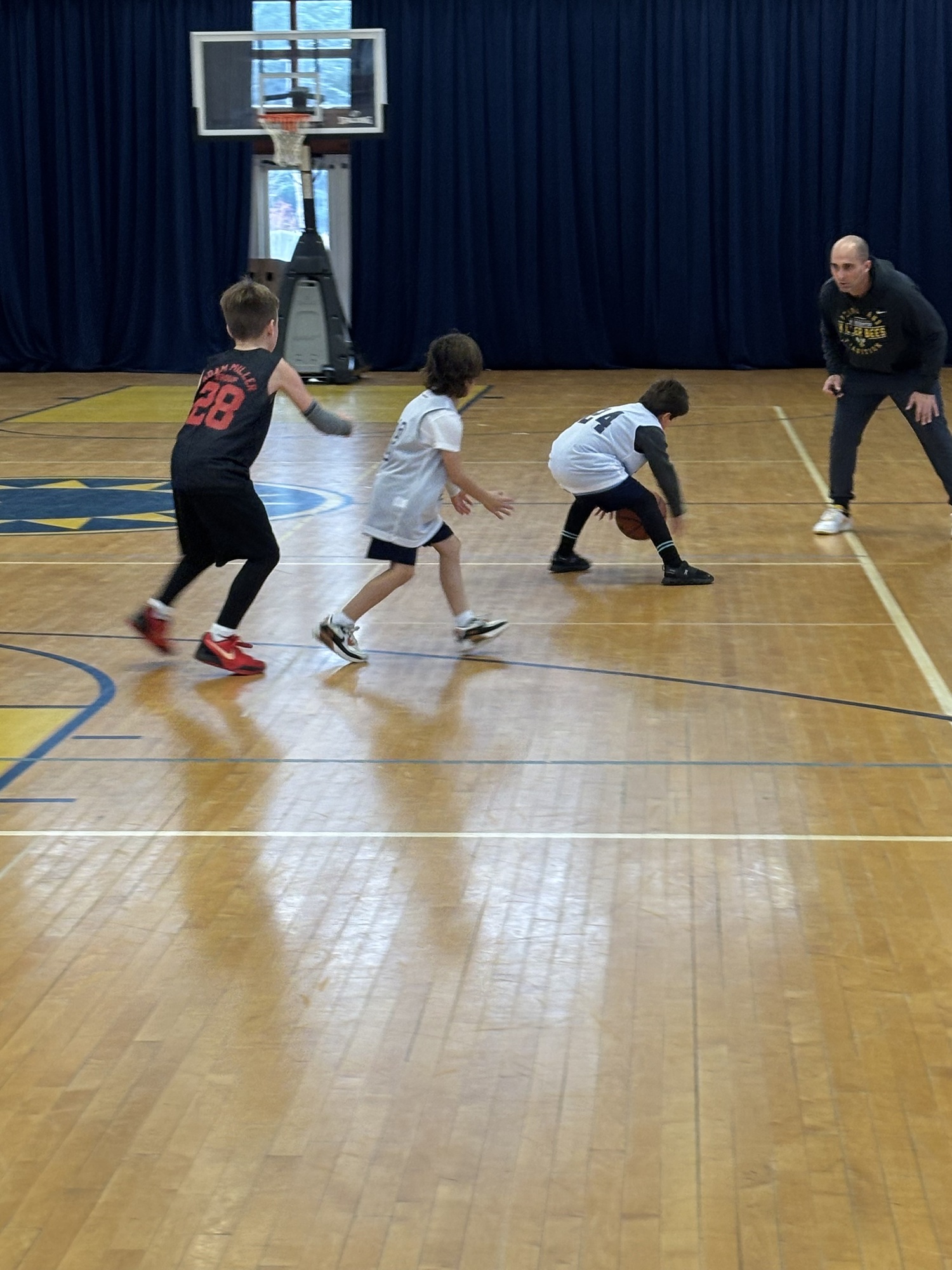 Young Ross School students participating in the second year of the school's participation in the East End Basketball Organization. COURTESY ROSS SCHOOL