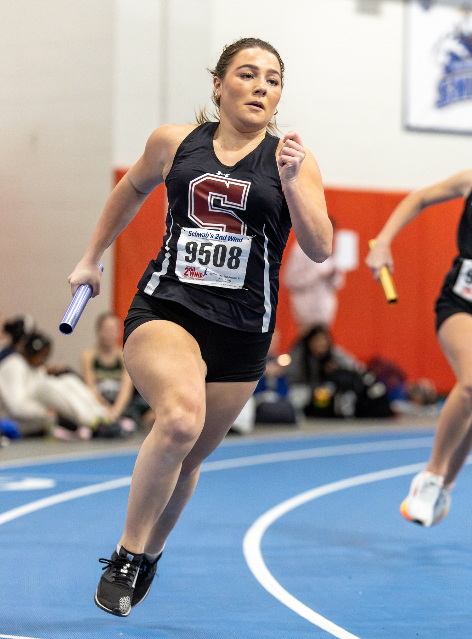 Senior Katie Terry running the opening leg of the 4x200-meter relay for Southampton on Sunday.  RON ESPOSITO