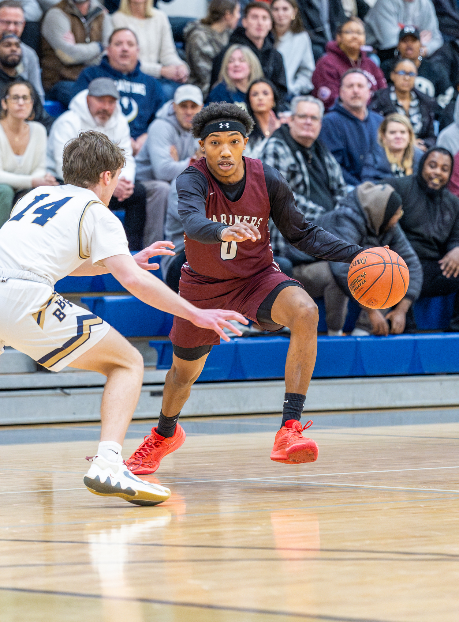 Southampton senior Naevon Williams has a step on Bayport-Blue Point's Tyler McKillop.   RON ESPOSITO