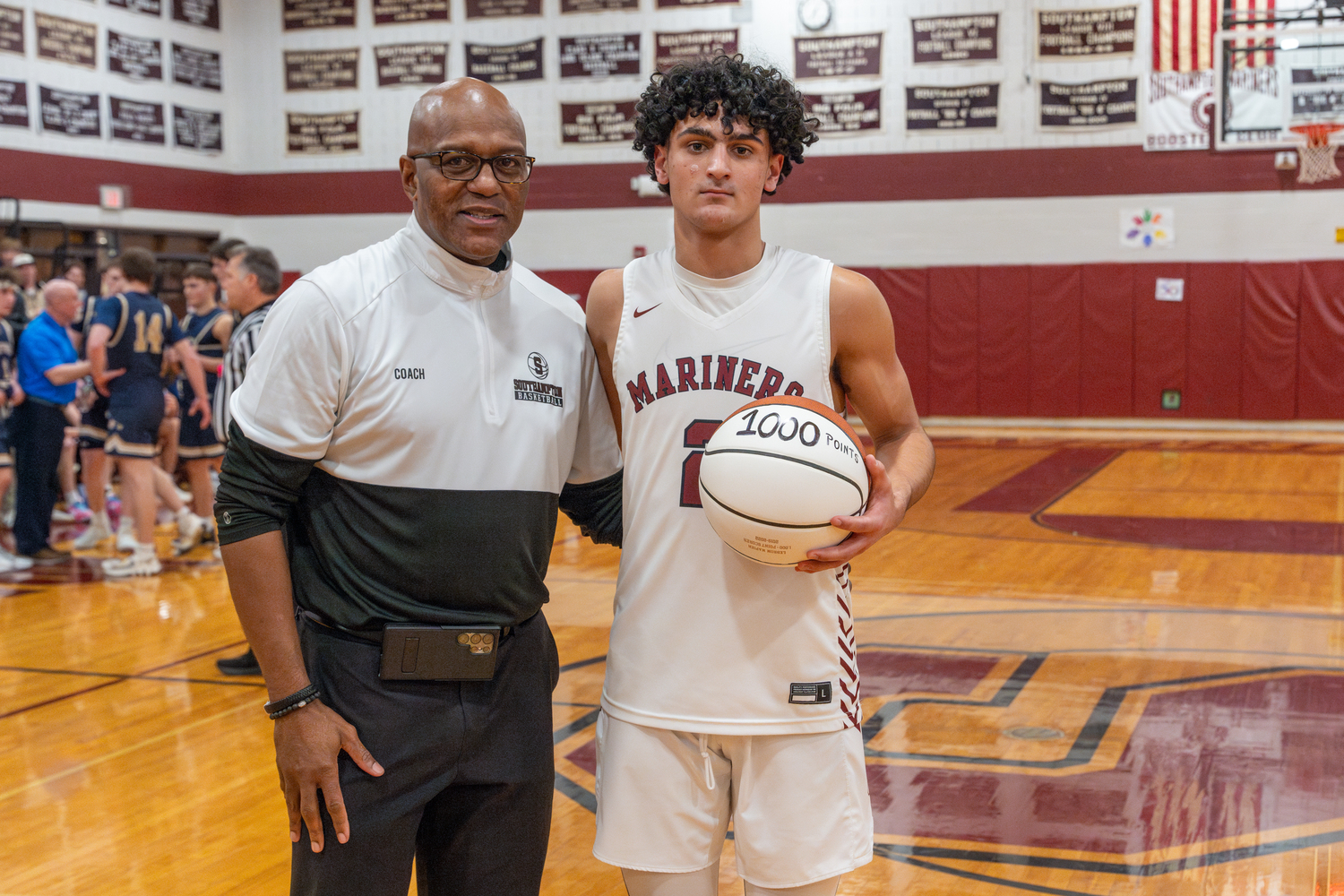 Southampton head coach Herm Lamison with his latest 1,000 career-point scorer Alex Franklin.   RON ESPOSITO/SOUTHAMPTON SCHOOL DISTRICT