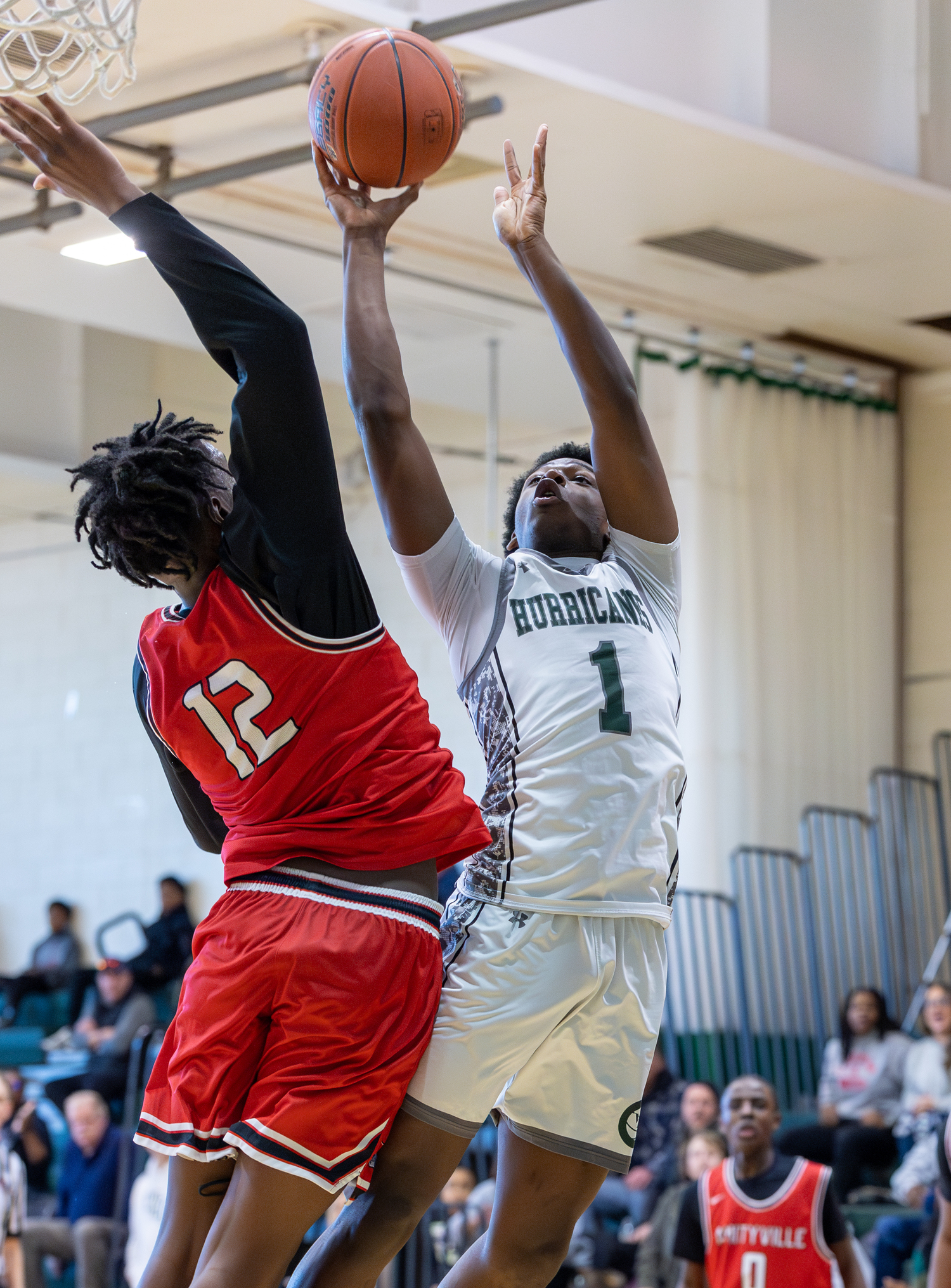 Junior guard Antonio Washington shoots over a block attempt. RON ESPOSITO