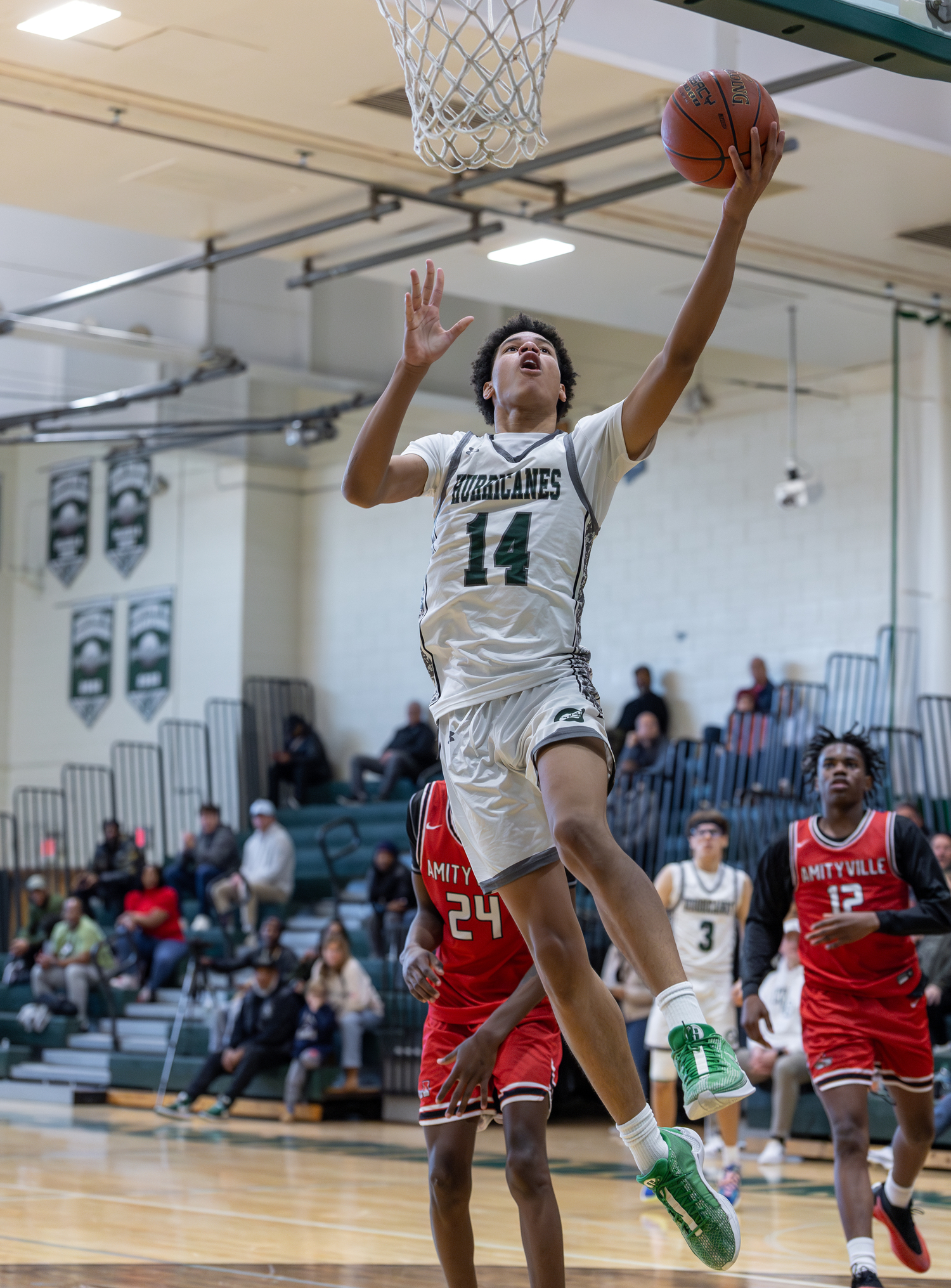 Senior center Jorden Bennett leaps to the rim. RON ESPOSITO